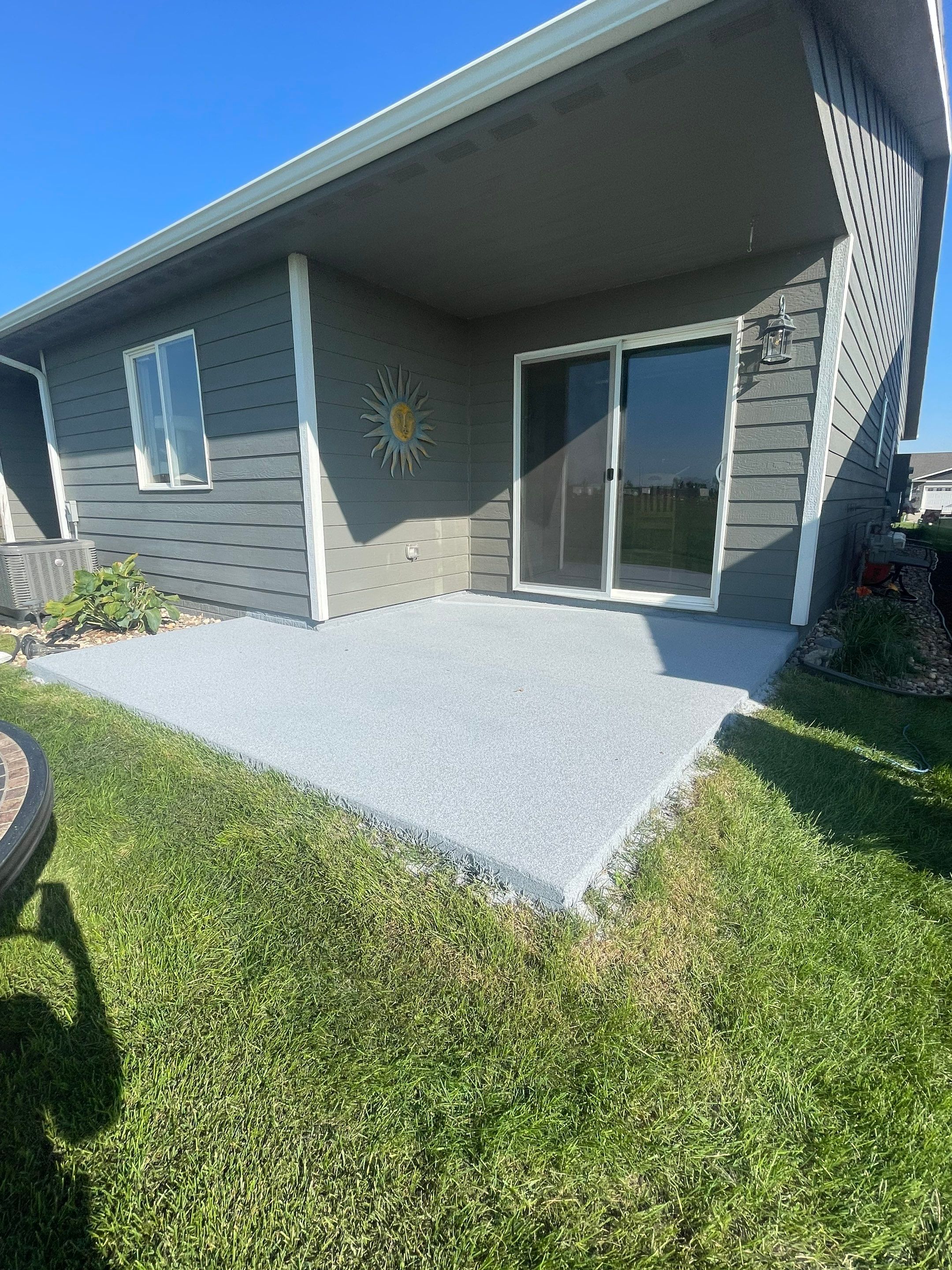Starry Evening Concrete Patio Coating Installation in Tea by Select Painting, Coatings & Garage Cabinets