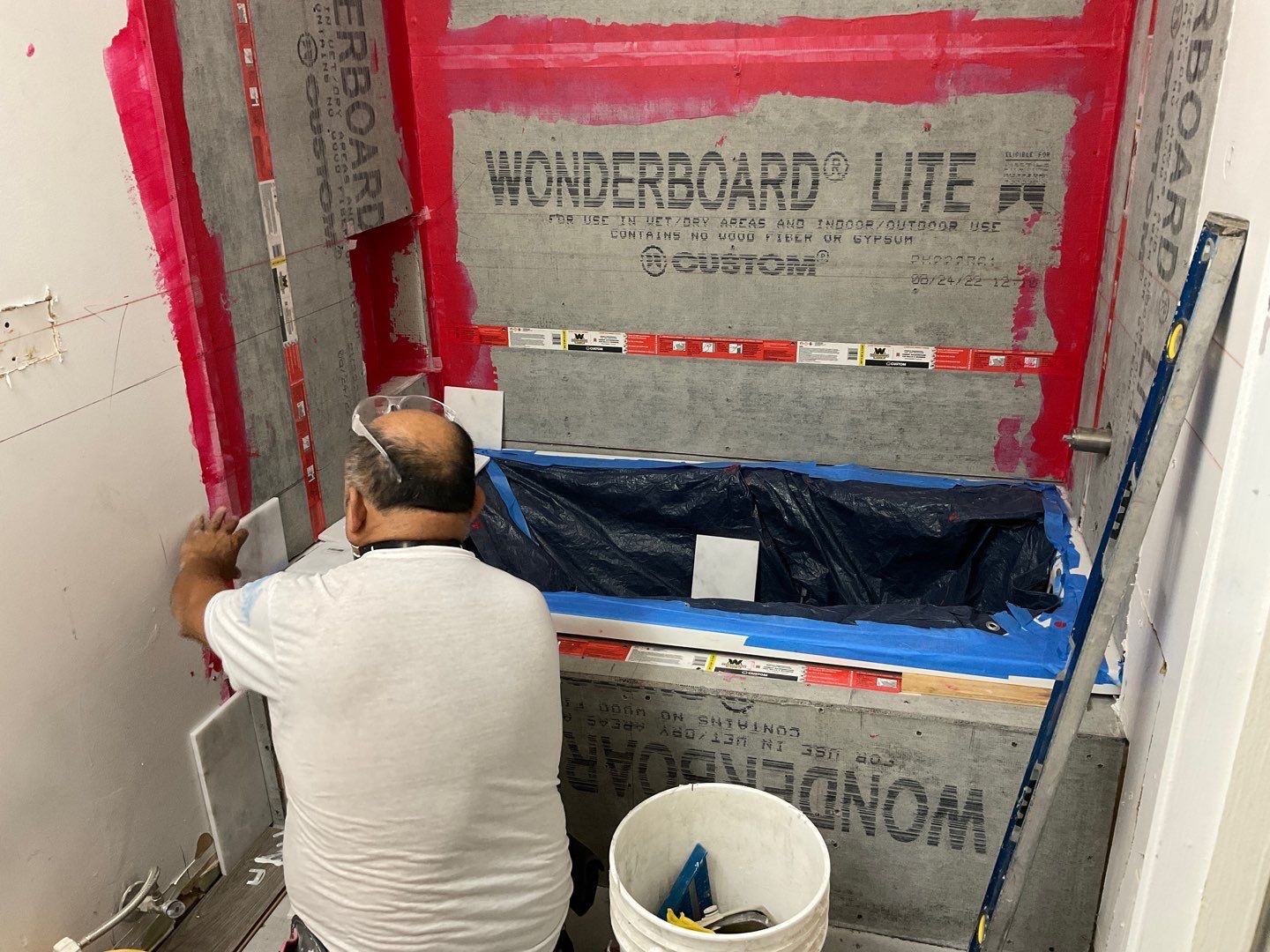 Bathroom Remodel using Two new bathroom design and new floors by Alpha Design Services