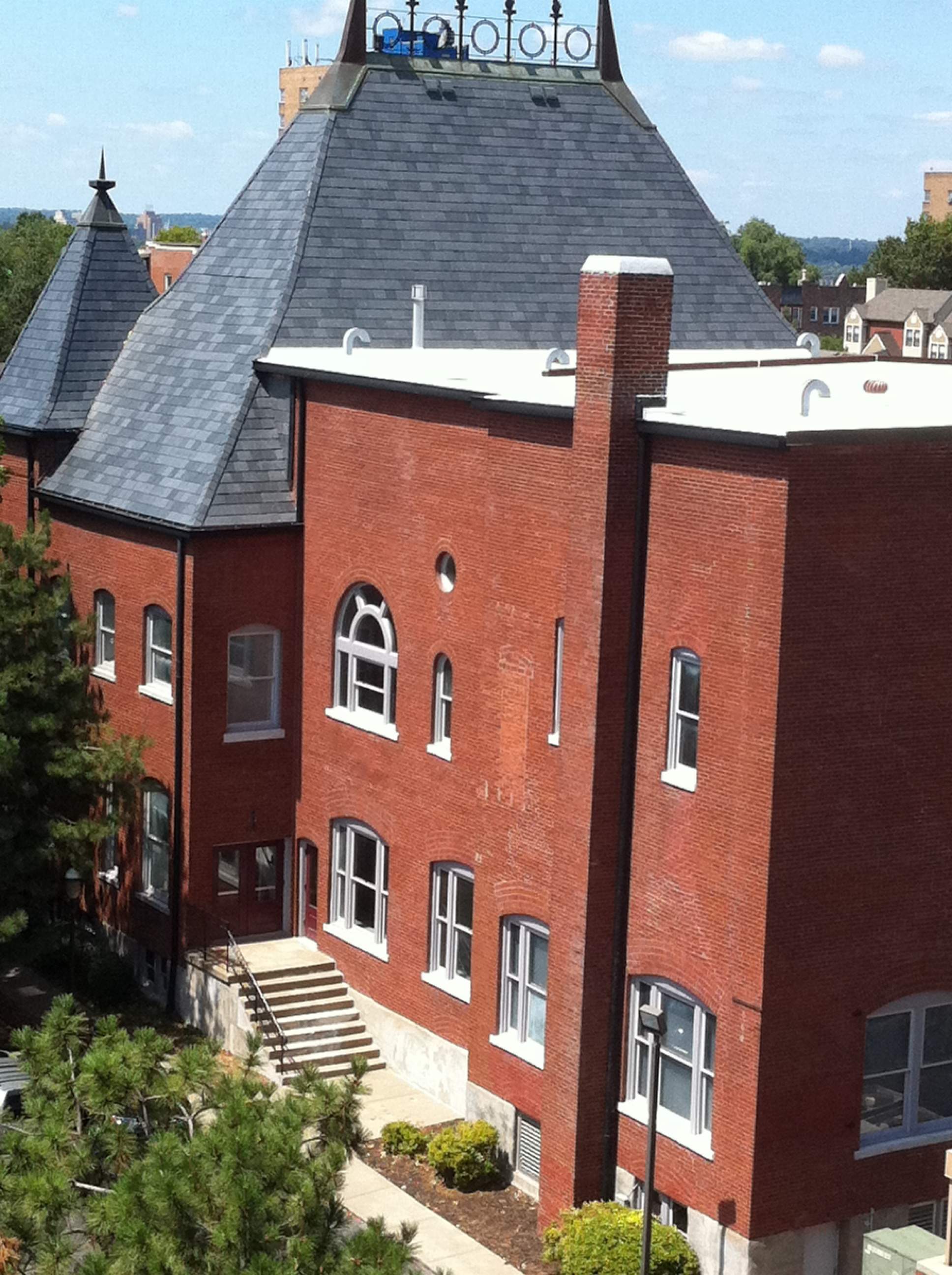 Historic Building ROOF REPLACEMNT with GAF TruSlate  on steep slop and Versico 60mil TPO on flat roof by Gorilla Exteriors Contracting, LLC