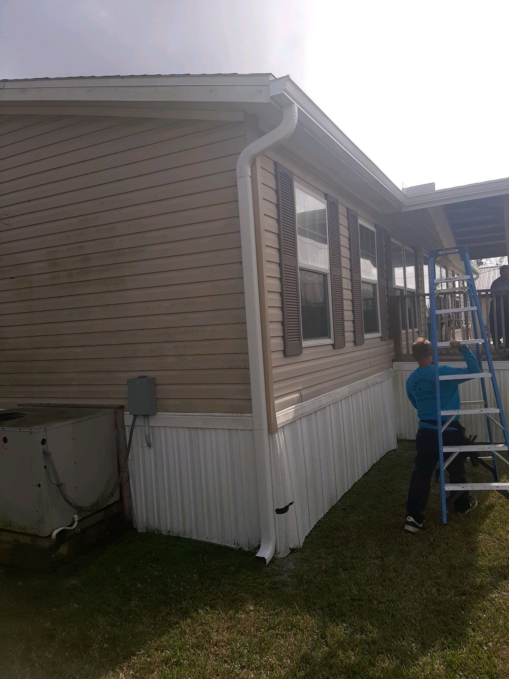 Gutter Installation using White Seamless Gutters by Gutter Professors