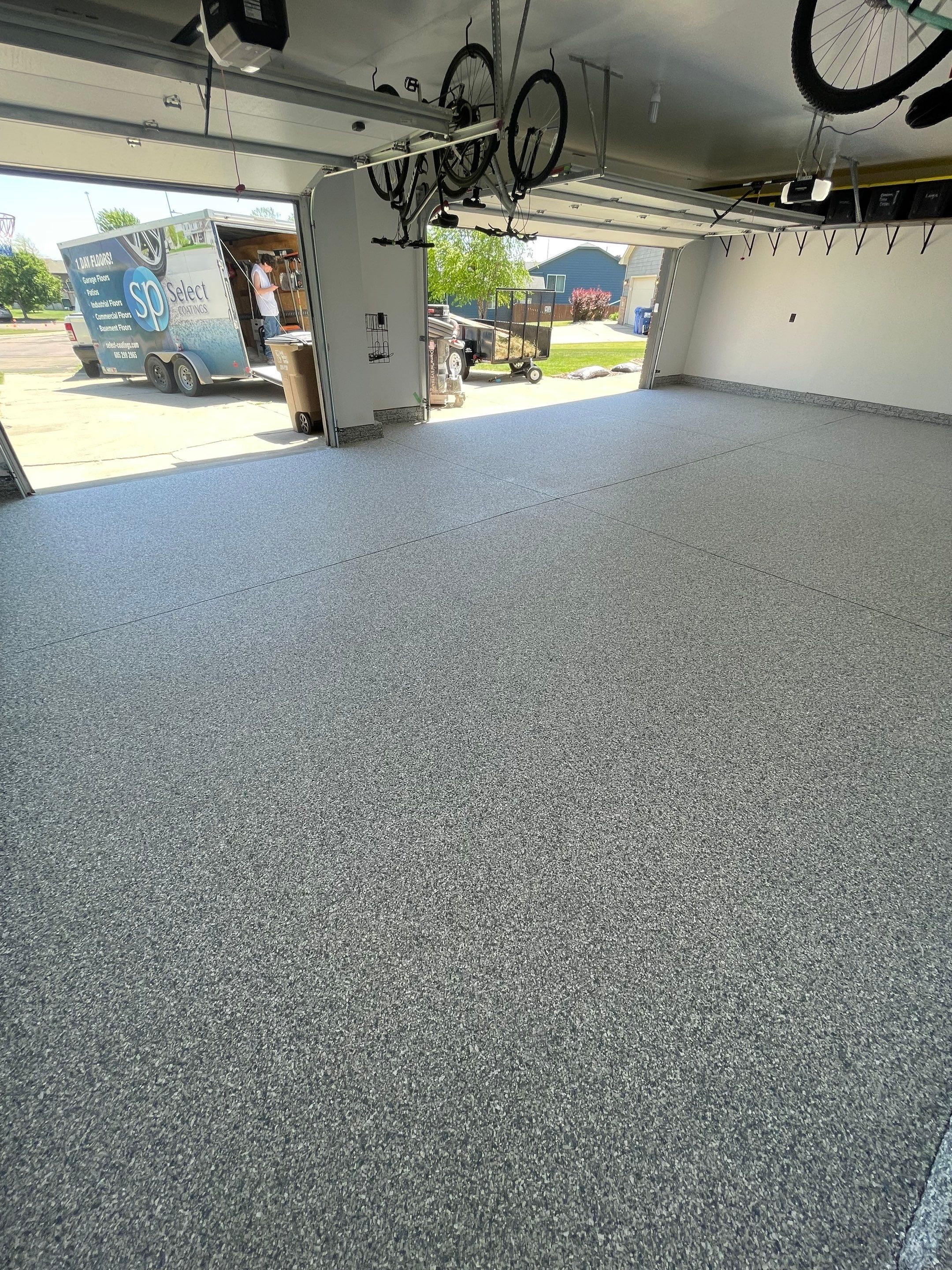 Tidal Wave Flake Garage Floor Installation in Sioux Falls by Select Painting, Coatings & Garage Cabinets