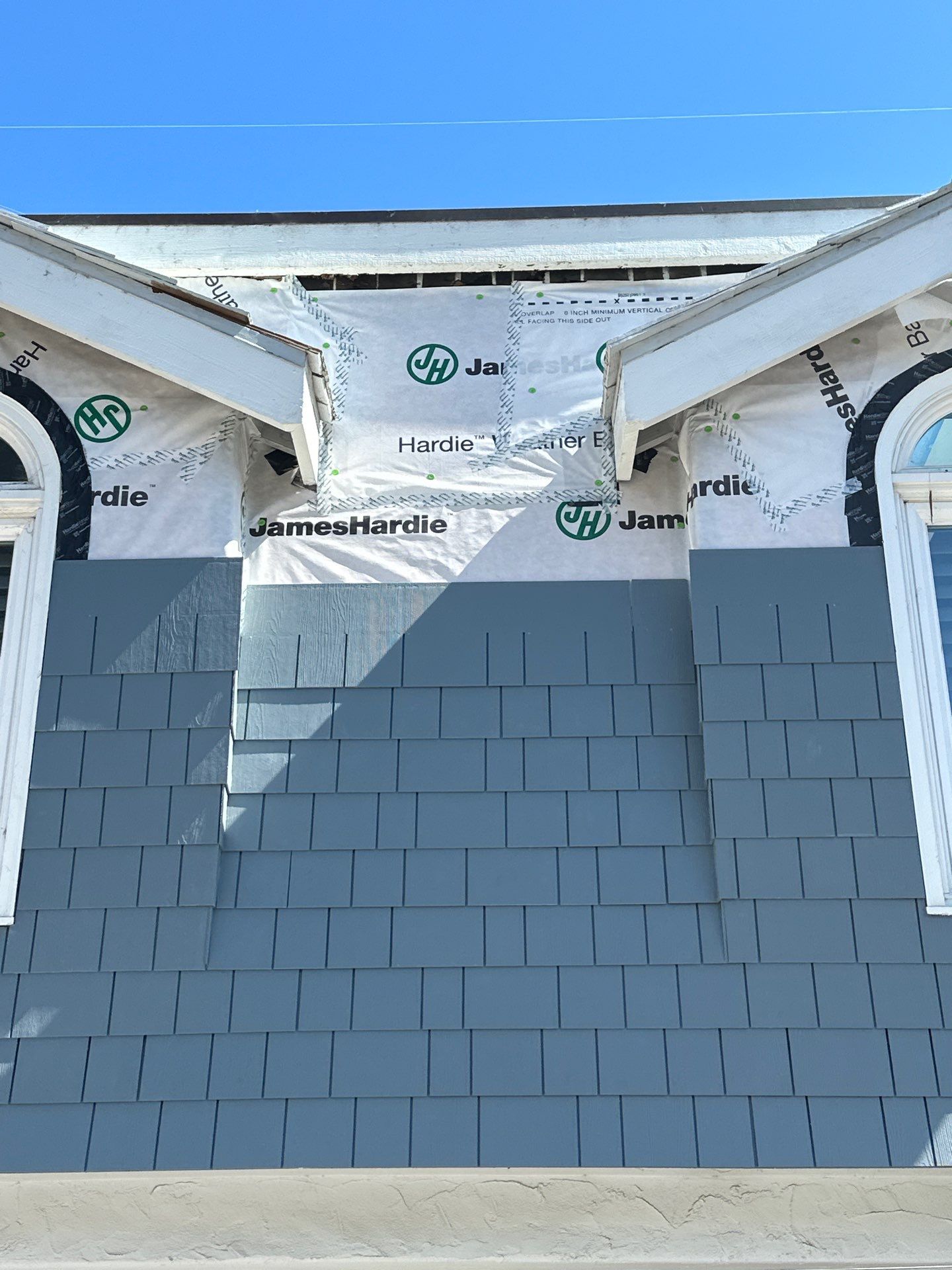 Pre-finish shingles by New Era Siding Inc 