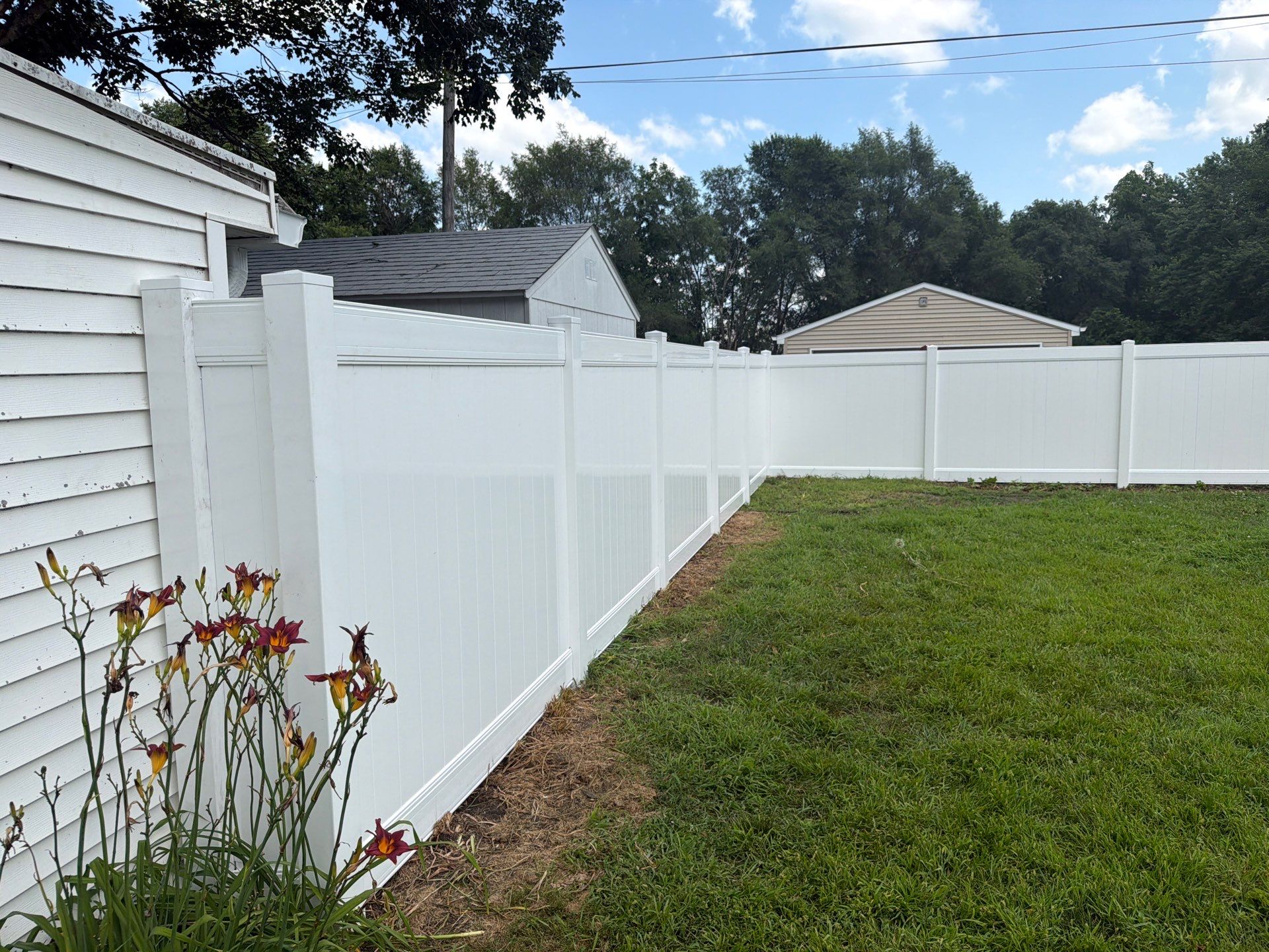 White Vinyl Privacy Fence Installation in Waterloo, Iowa by Perfect Picket Fence and Stain