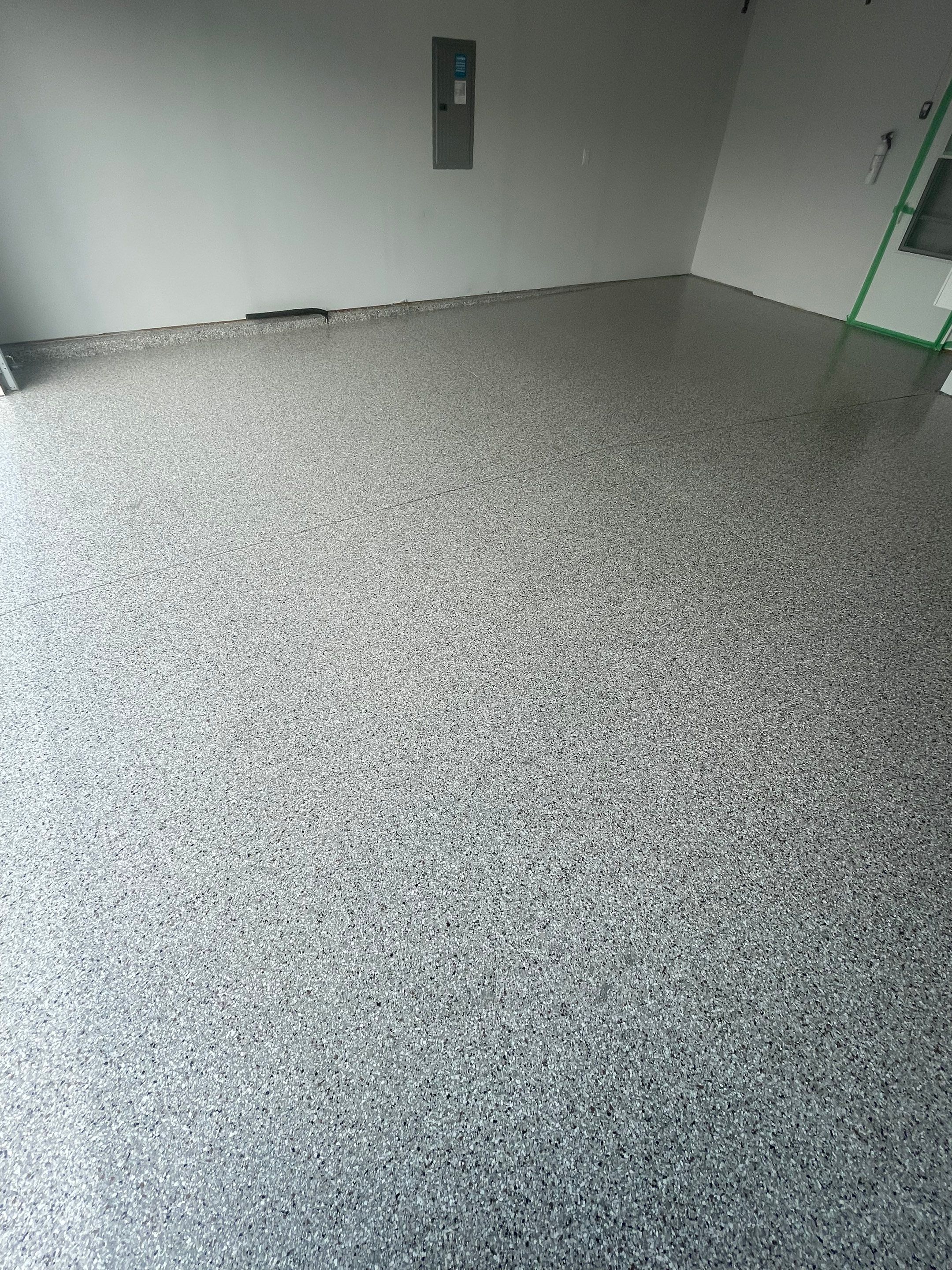 Custom Coyote Flake Garage Floor Coating in Sioux Falls by Select Painting, Coatings & Garage Cabinets