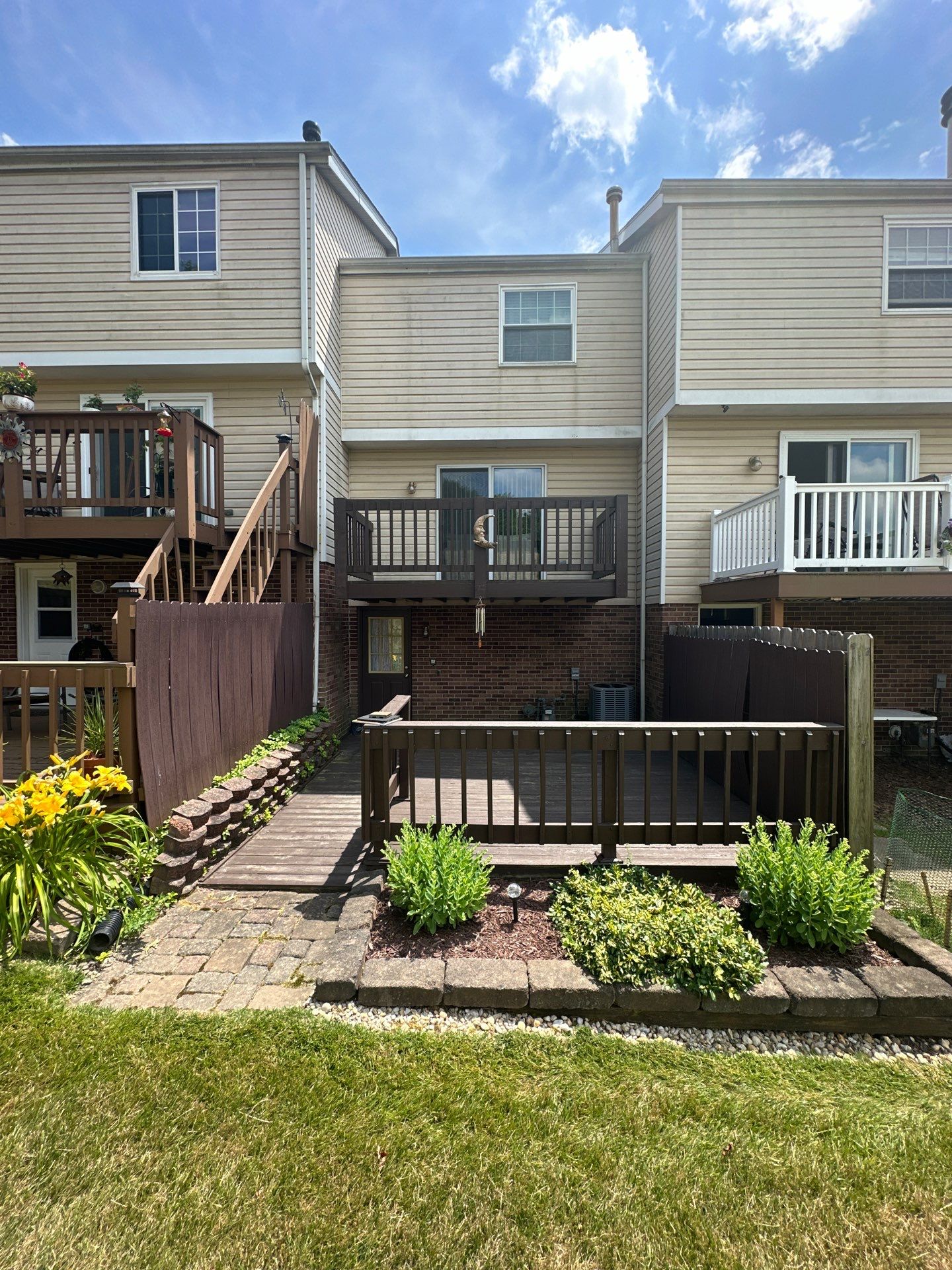 Stamped concrete and redeck  by Cousins Roofing Siding & Decks