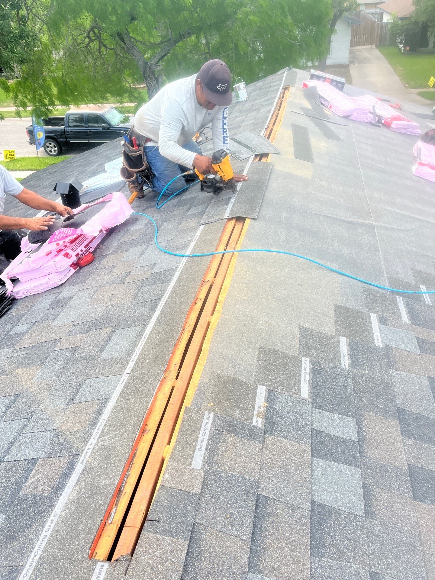 Colored Vinyl Windows to blend into brick by Bayfront Roofing and Construction