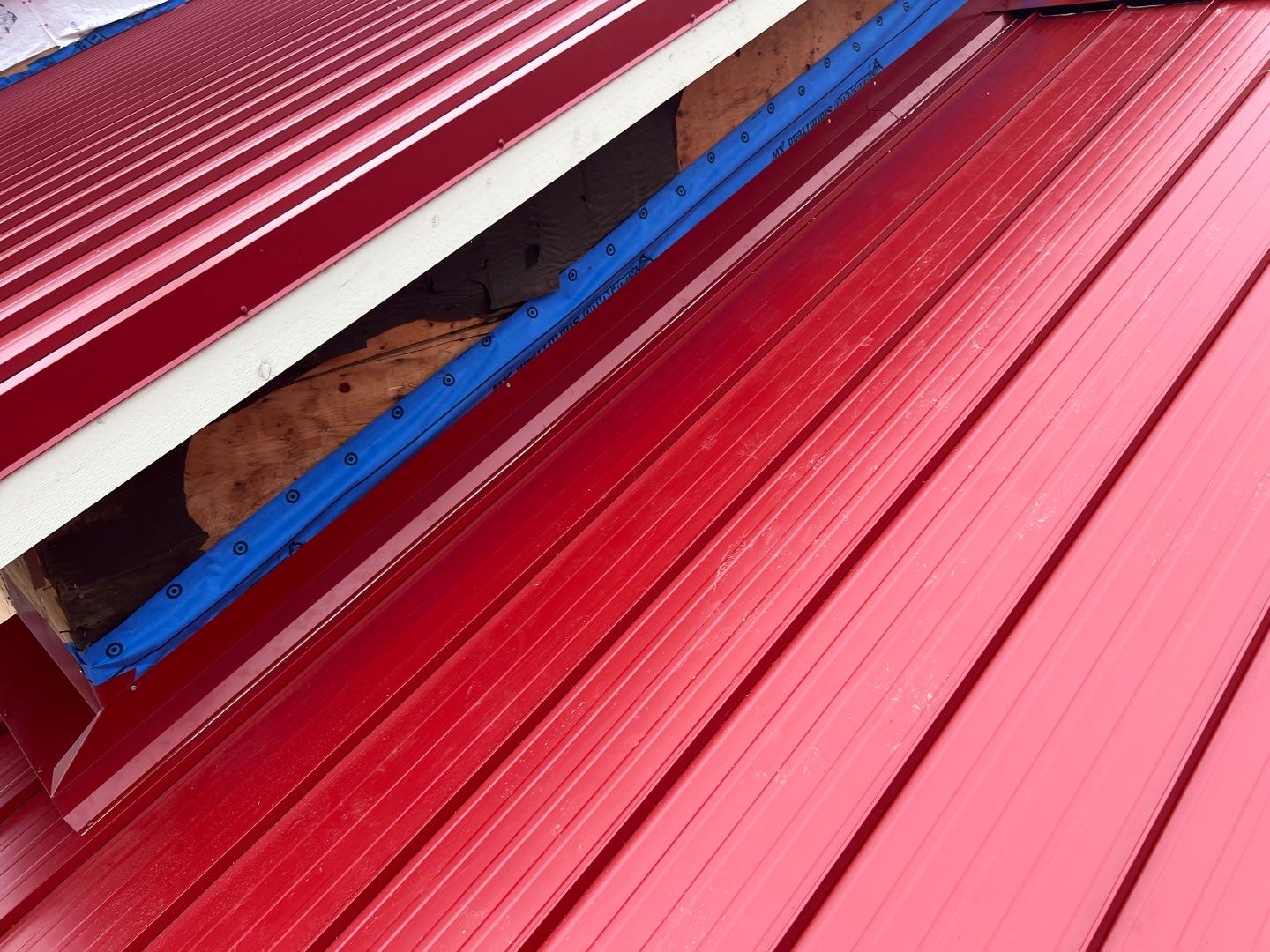 Commercial Roofing Installation using 12" Prolok metal  by Top Notch Roofing Inc