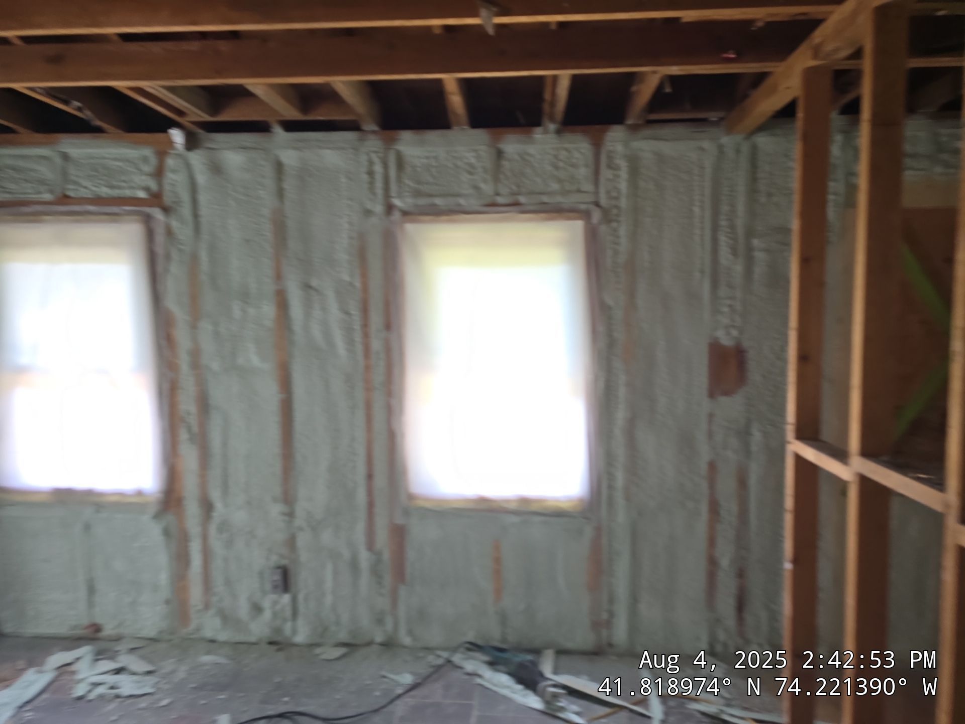 Master bedroom Exterior Walls using open cell spray foam by NYS Foam & Energy