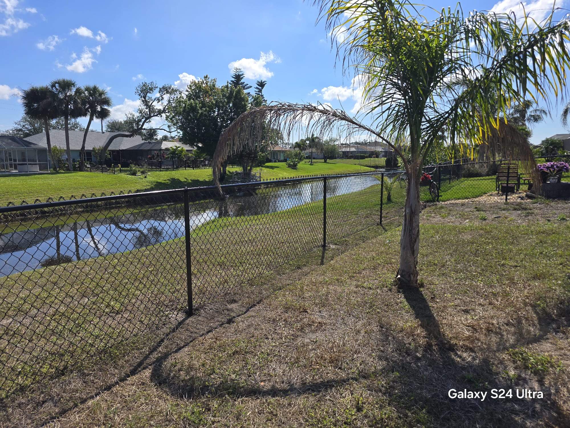 Waterfront Black Chain Link Fence Installation in Rotonda West by True Fence LLC