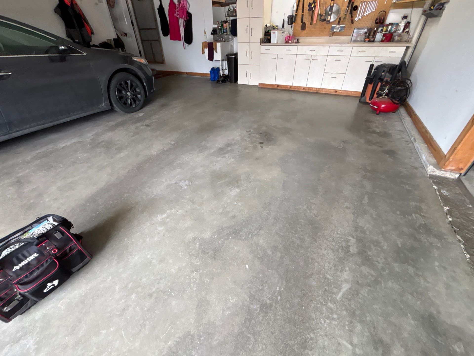 Gray and Black Speckled Polyurea Garage Floor in Dell Rapids by Select Painting, Coatings & Garage Cabinets