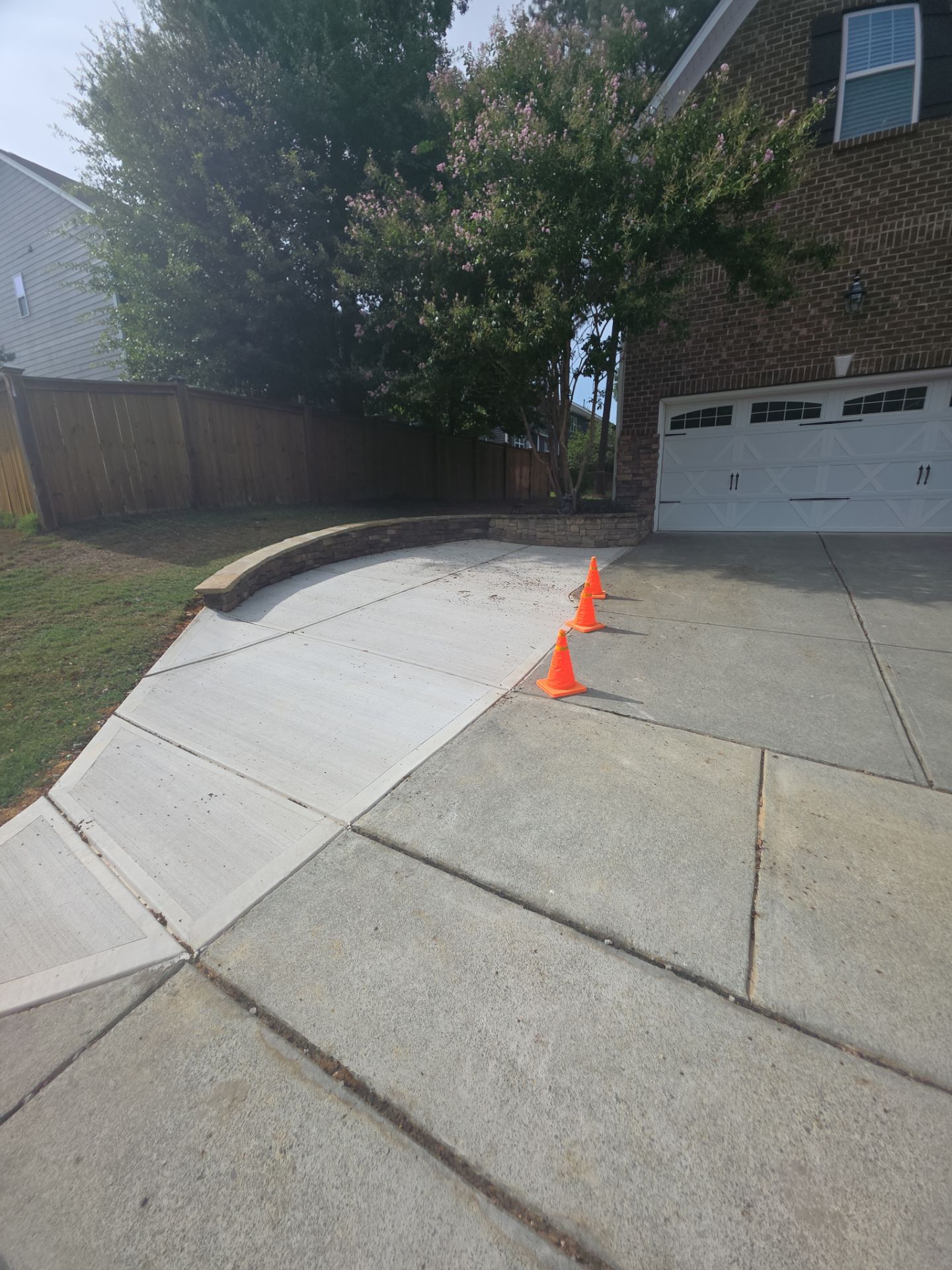 Concrete Driveway Expansion & Retaining Wall | Apex, NC by Elite Remodeling and Design LLC