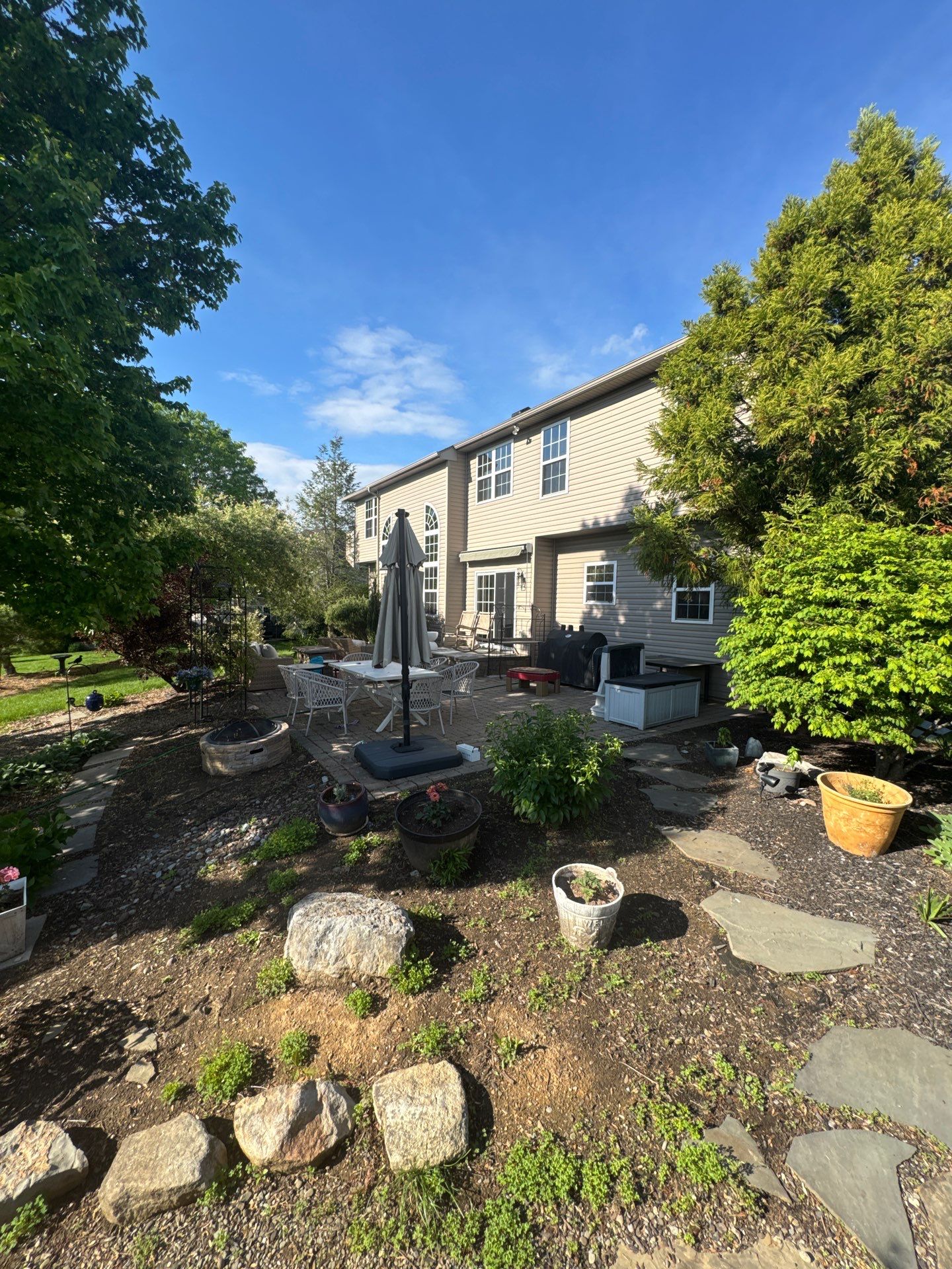 Backyard Retreat: Techo-Bloc Patio + Firepit Lounge by Saylor’s Lawn & Landscape