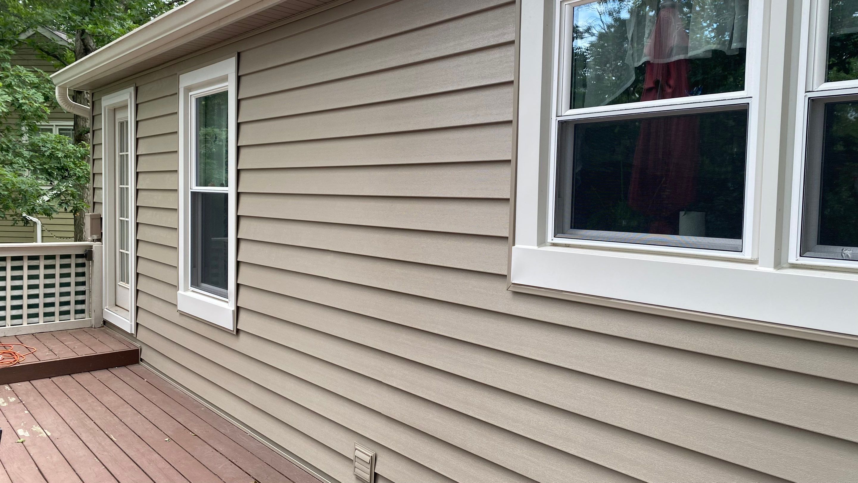 Mastic Siding + Interstate Windows by American Home Contractors