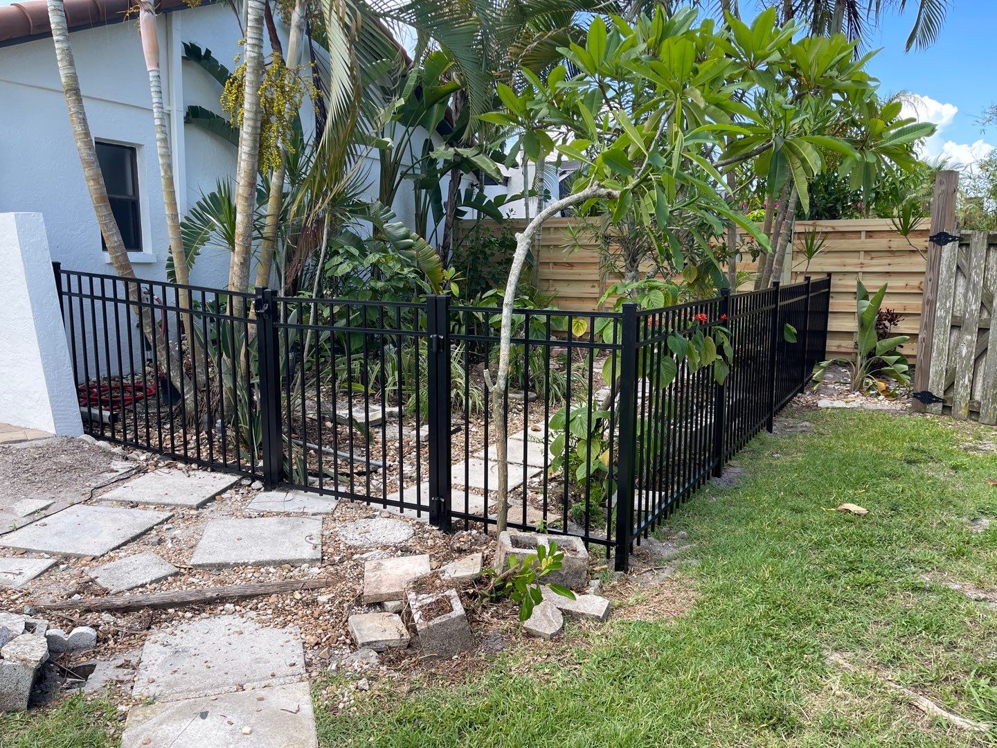 Sarasota, FL 6ft. Tall Horizontal Shadowbox Wood with 4ft. Tall 3-Rail Black Aluminum Fence by Asap fence and gates, LLC