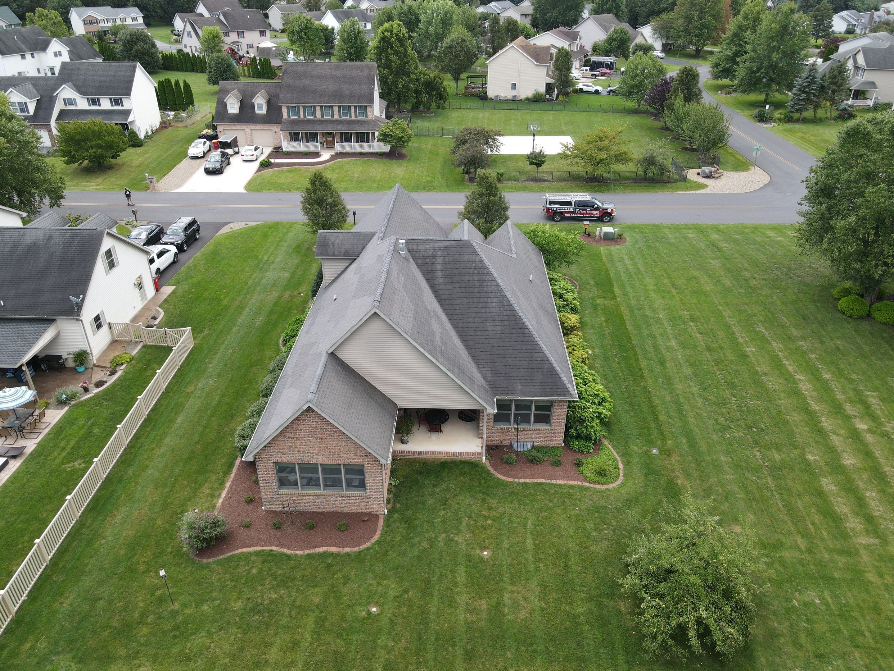 Standing seam / Azm panel in black  by Teflon Roofing