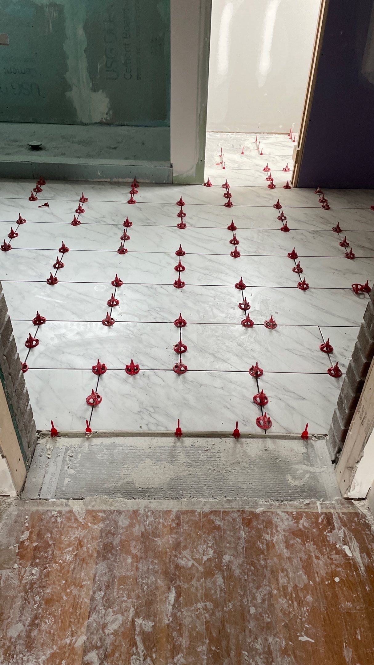 Remodeled Home with new tile floors, Showers and Refinished Oak Floors with stain and Waterbased Finish by Footprints Floors of Coastal Carolina