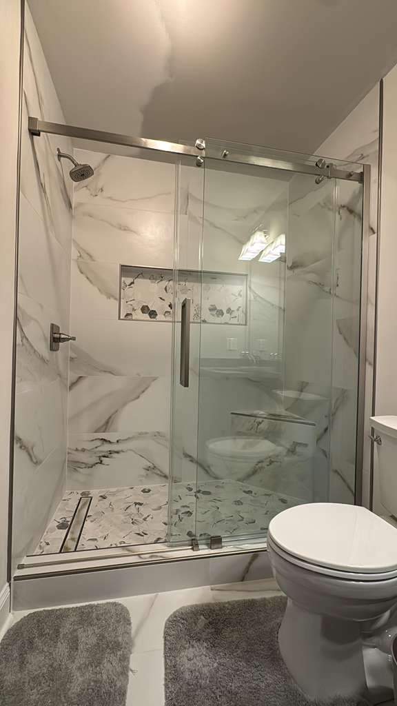 Three showers renovation by Prudencio