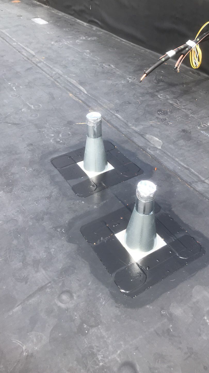 Commercial Roofing Installation using EPDM with white gutters by A Plus Exterior