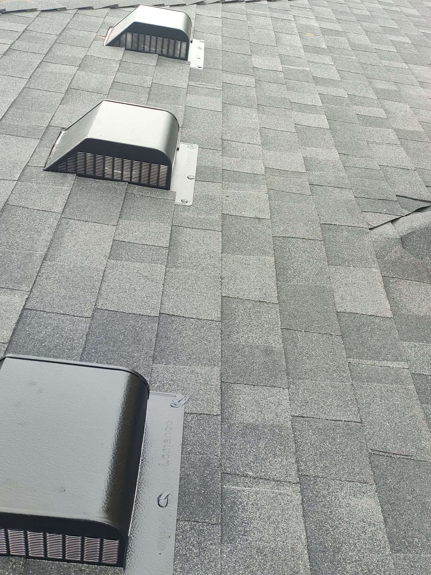 Nothing looks nicer than a little black roof by Bayfront Roofing and Construction