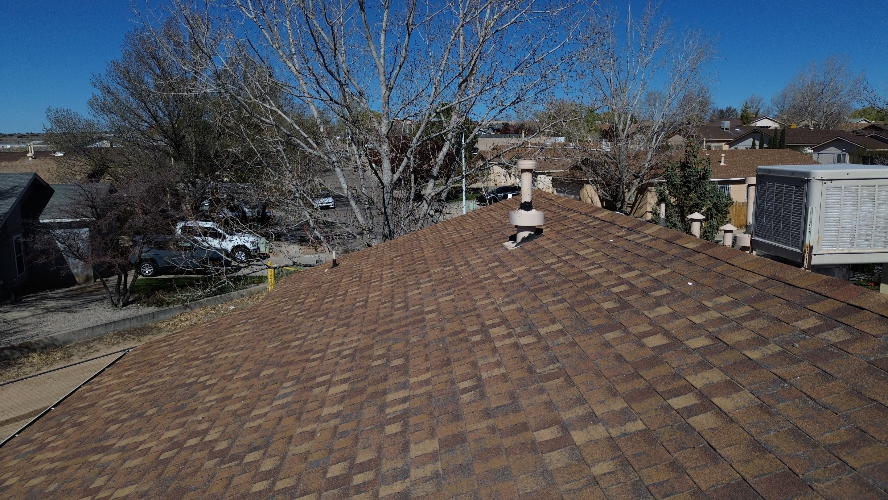Oakridge Desert tan shingles in Chimayo Meadows by Doyle Roof Masters Inc