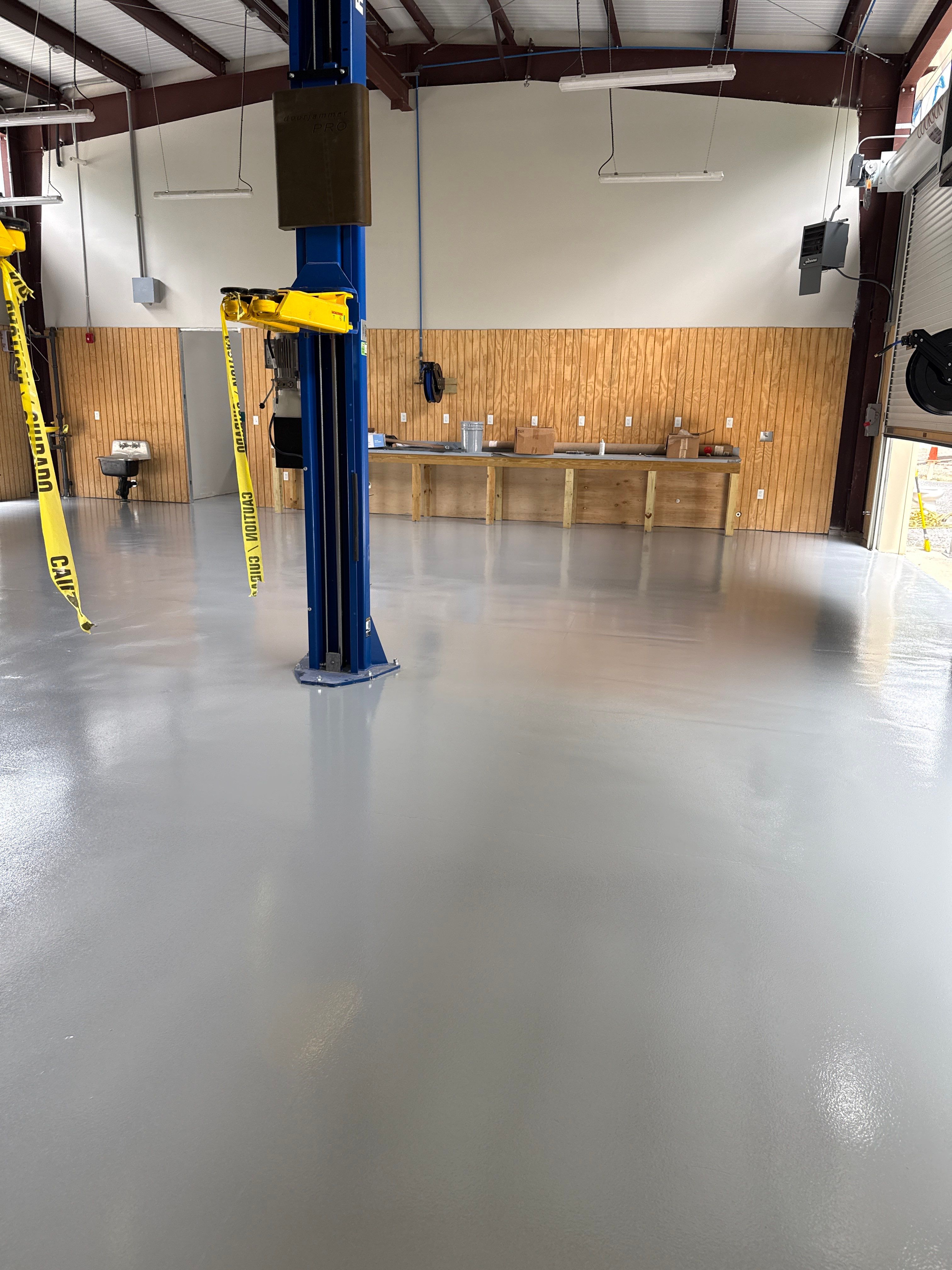 Industrial Epoxy Flooring for Sandhill Crane Workshop in Gautier by Cornerstone Hard Surface Restoration 
