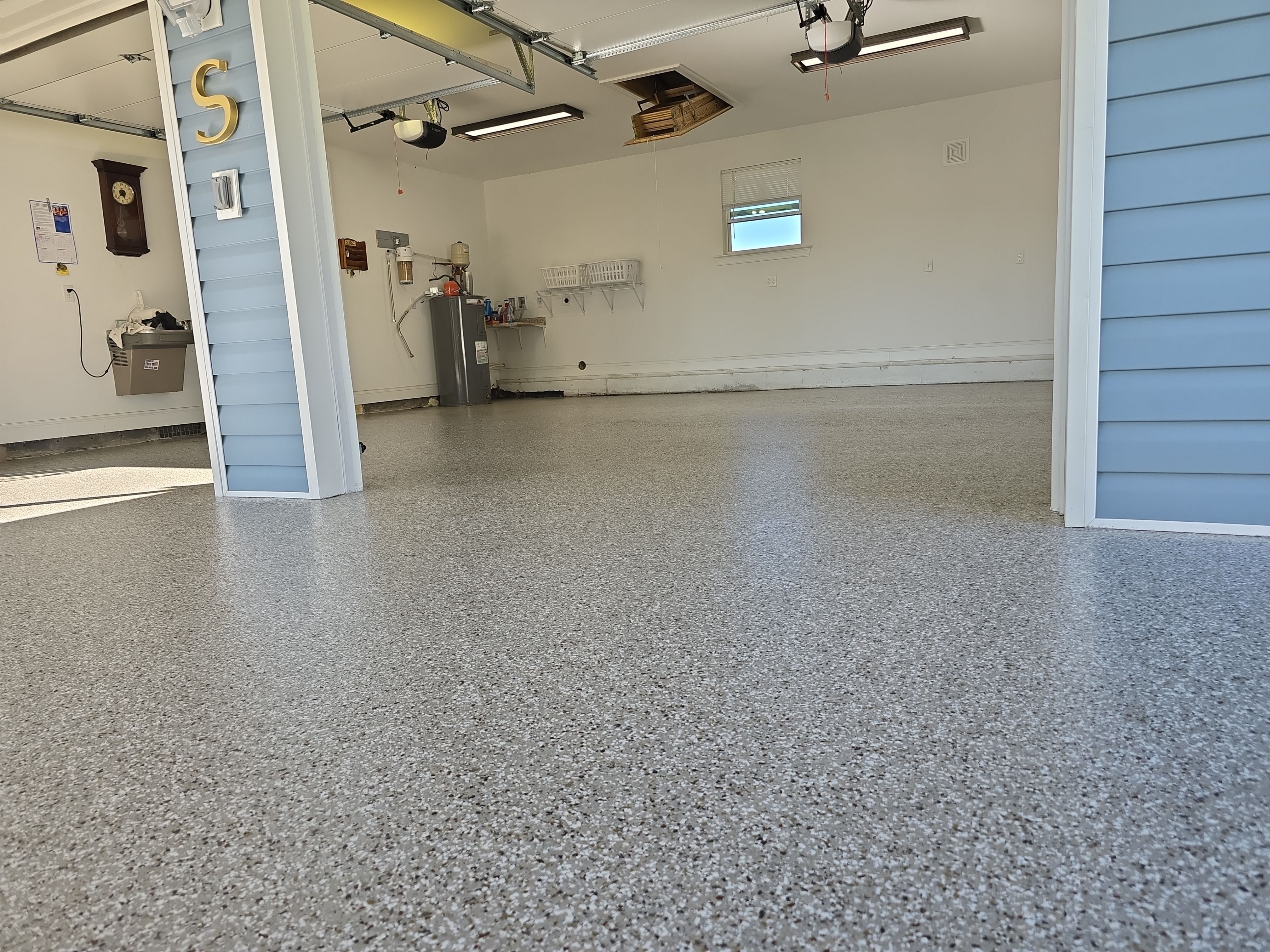 Garage & Patio Transformation Using Creekbed by Elite Floor Solutions