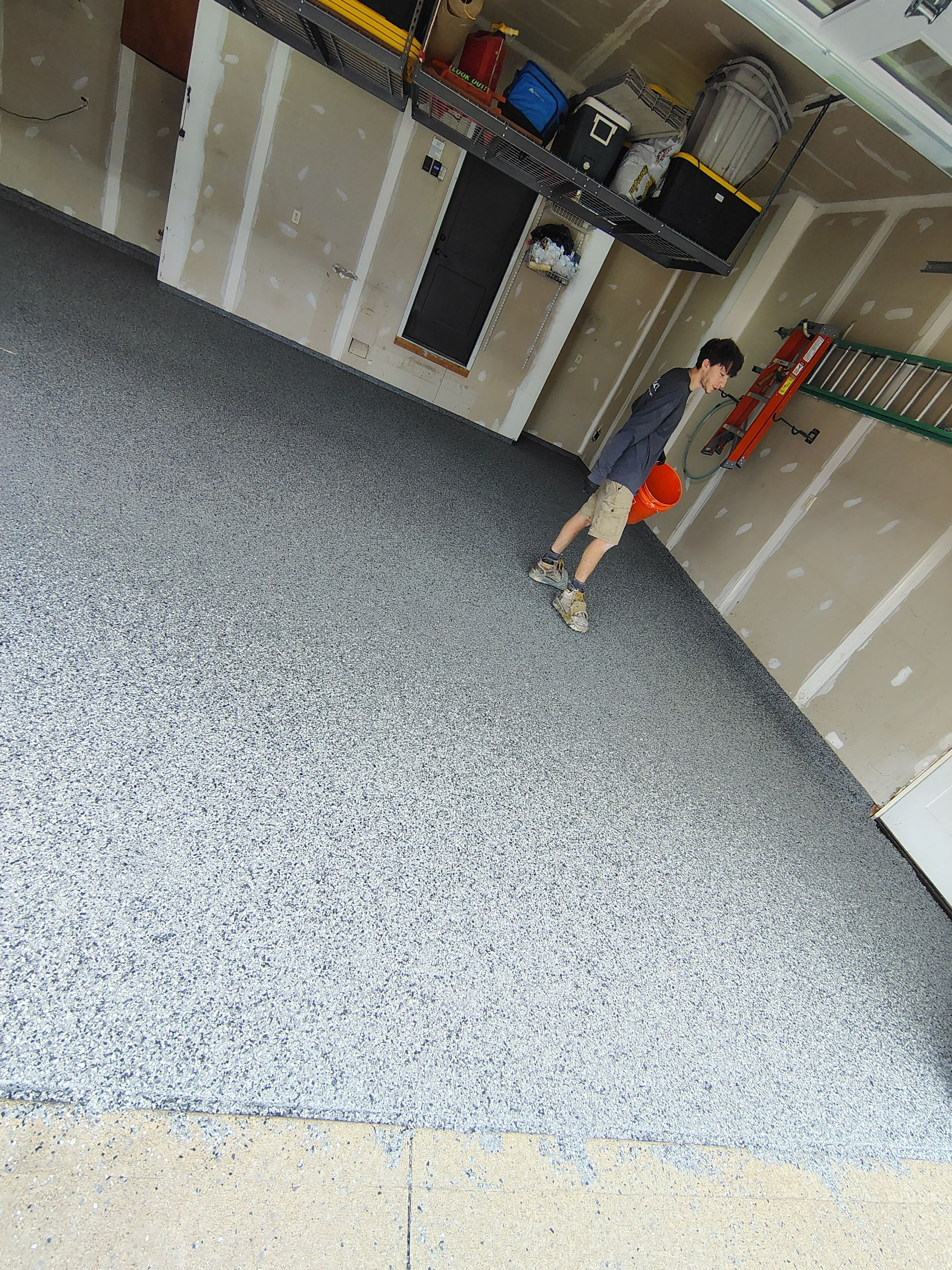 Sioux Falls Garage Concrete Grinding and Nightfall Decorative Chip Coating by Select Painting, Coatings & Garage Cabinets
