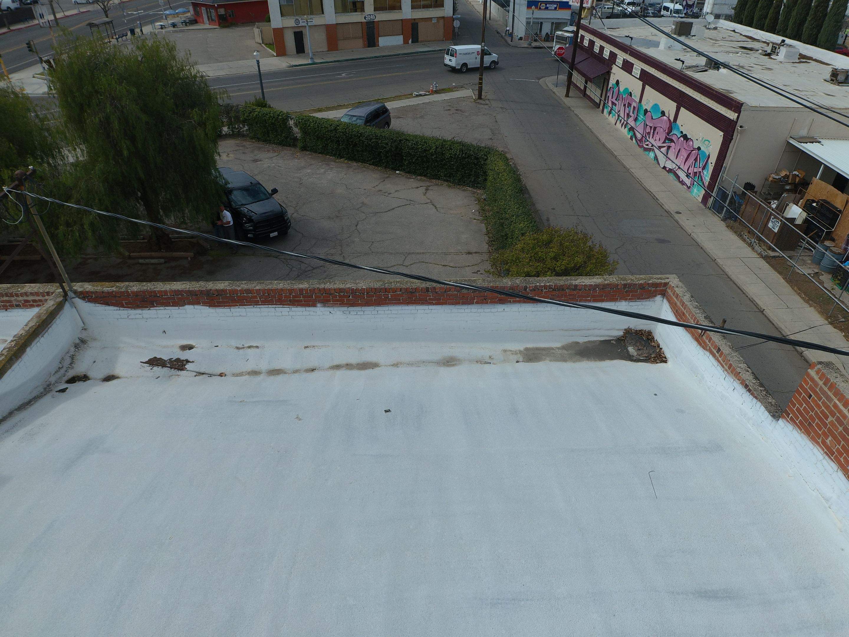 Polyurethane foam roof refurbish and recoating by Straight Edge Roofing Inc