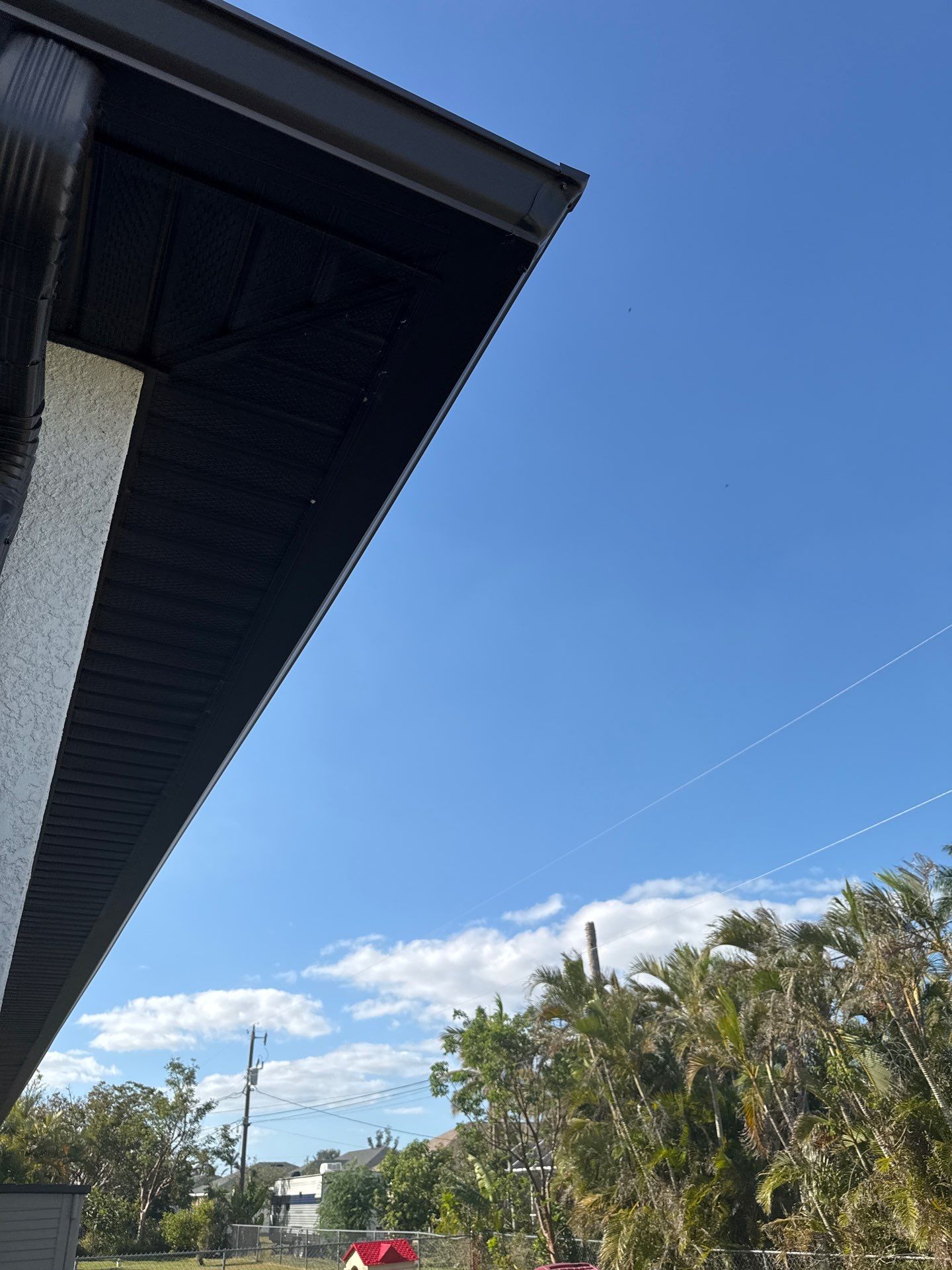 Dark Seamless Gutters and Downspouts in Cape Coral FL by Gutter Professors