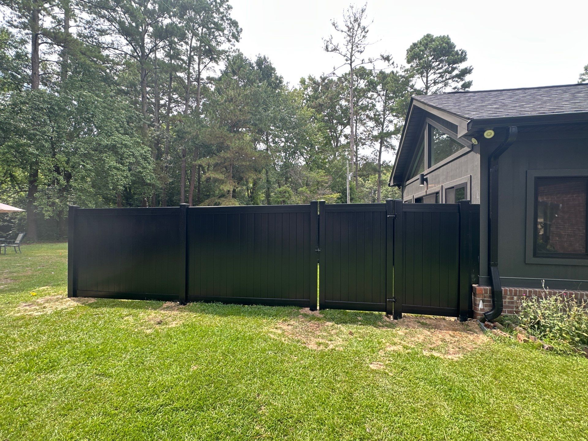 Black Vinyl Privacy Fence with Puppy Picket Aluminum Installation in Roseboro by Superior Fence and Rail