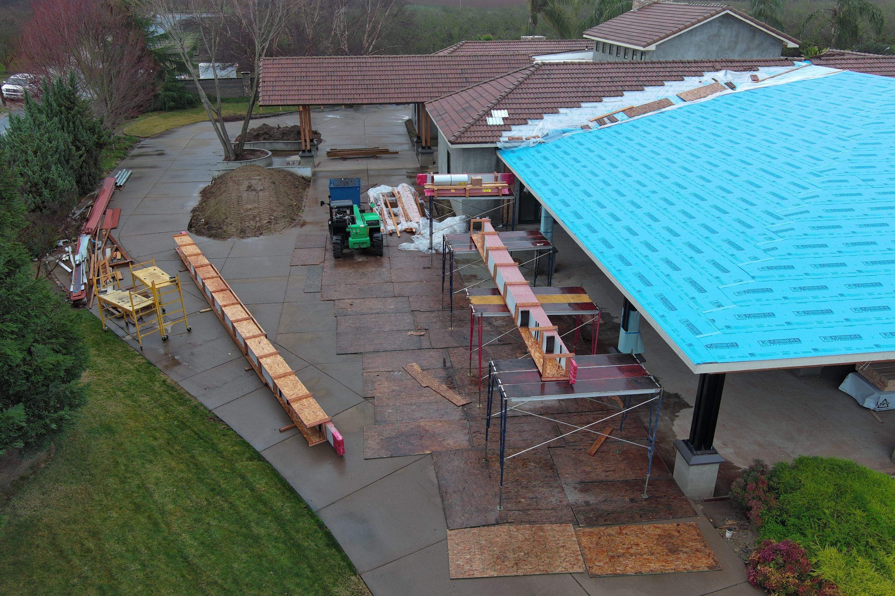 Tile, Metal, and TPO roofing project (new construction) by Straight Edge Roofing Inc