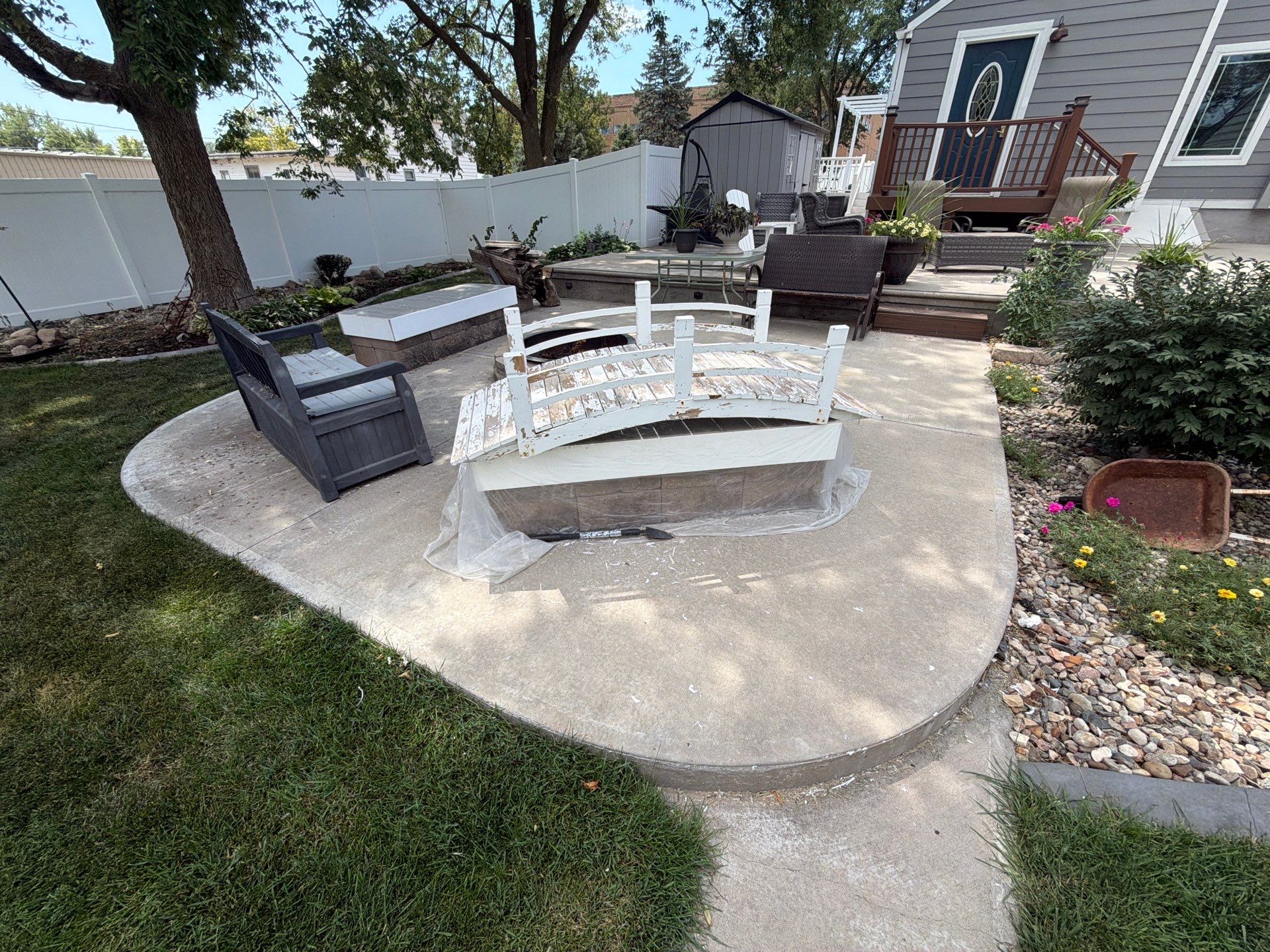 Custom Garage Floor Coating and Backyard Patio Refinishing in Tyndall by Select Painting, Coatings & Garage Cabinets