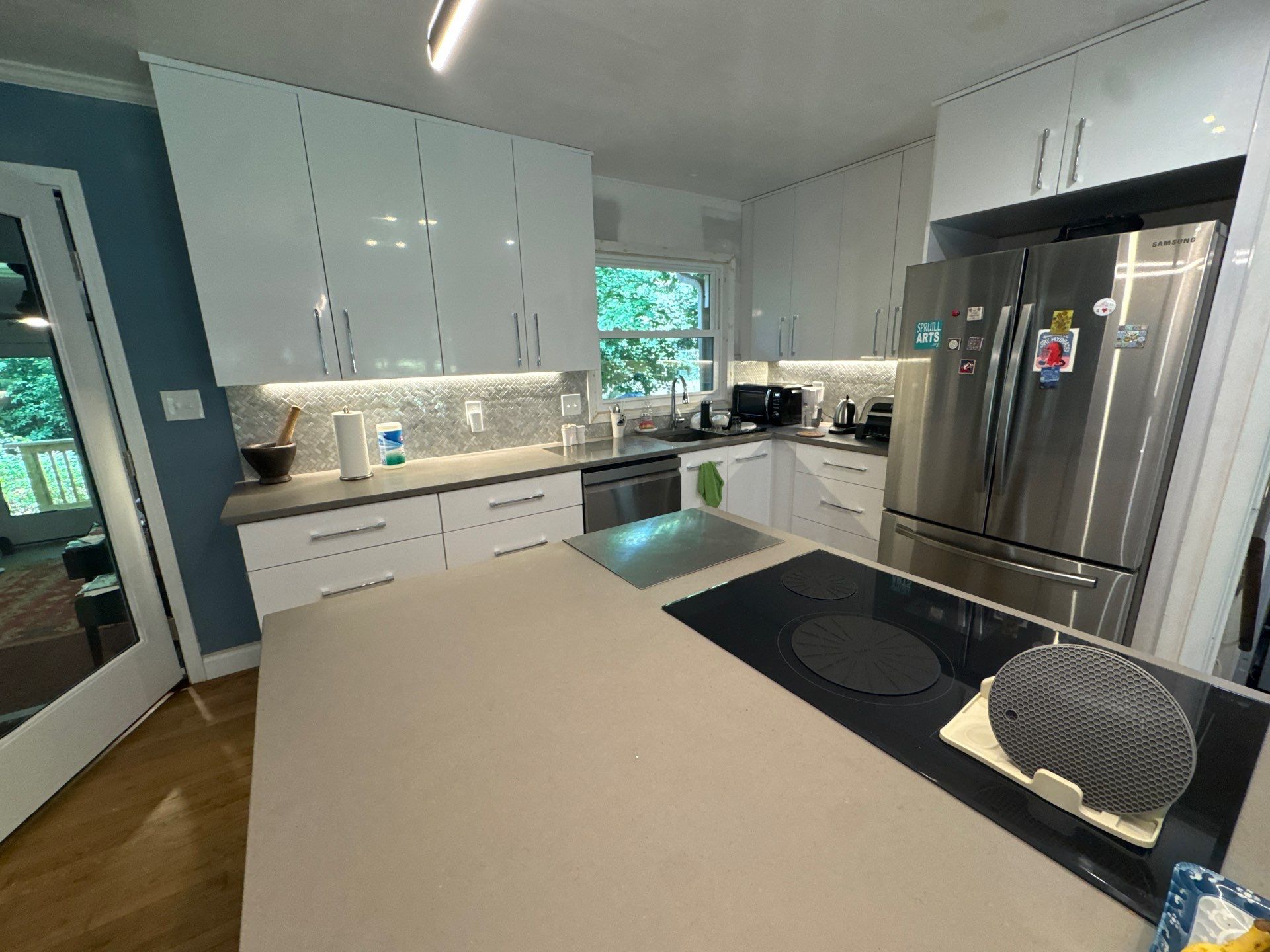 Modern Kitchen Remodeling with Large Central Island in Doraville by Swift Home Renovations