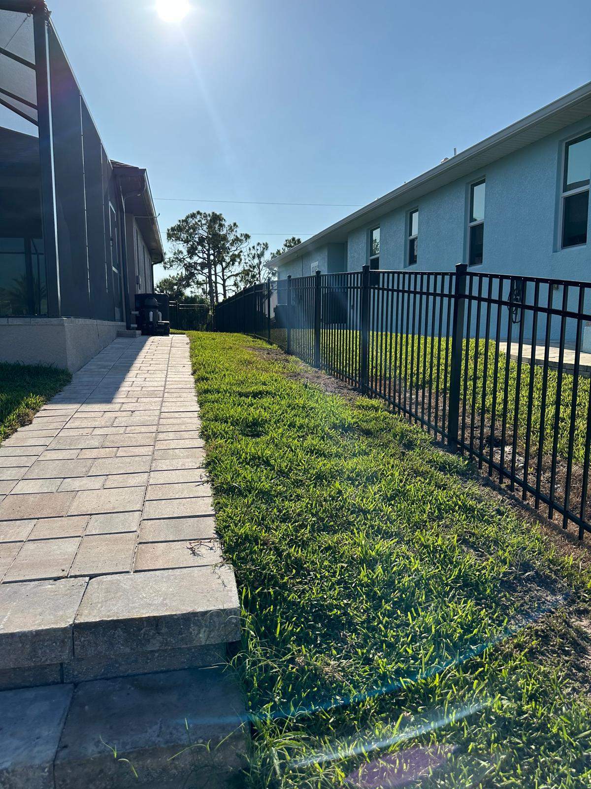 Waterfront Black Aluminum Fence Installation in Port Charlotte by True Fence LLC