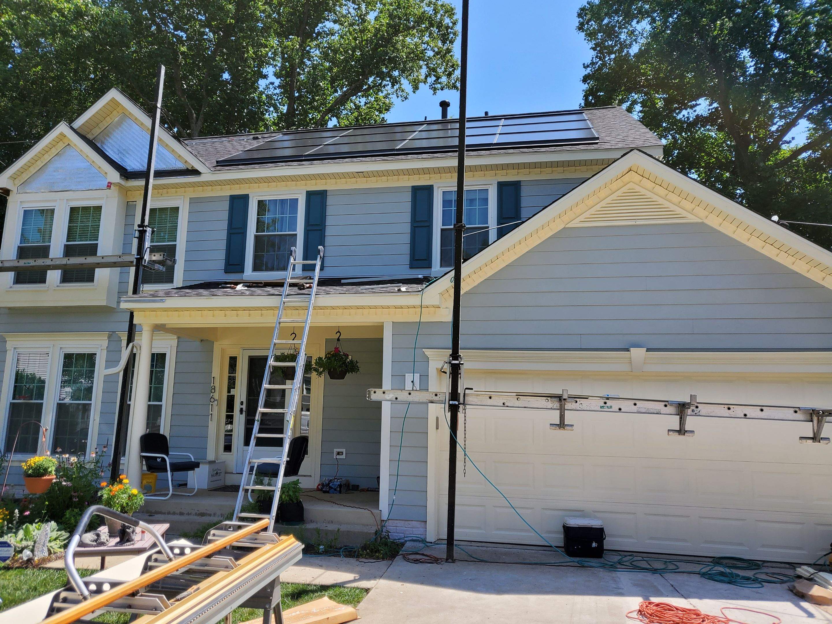 Exterior Home Makeover using GAF Timberline HDZ, GAF Decotech, and James Hardie Siding by American Home Contractors