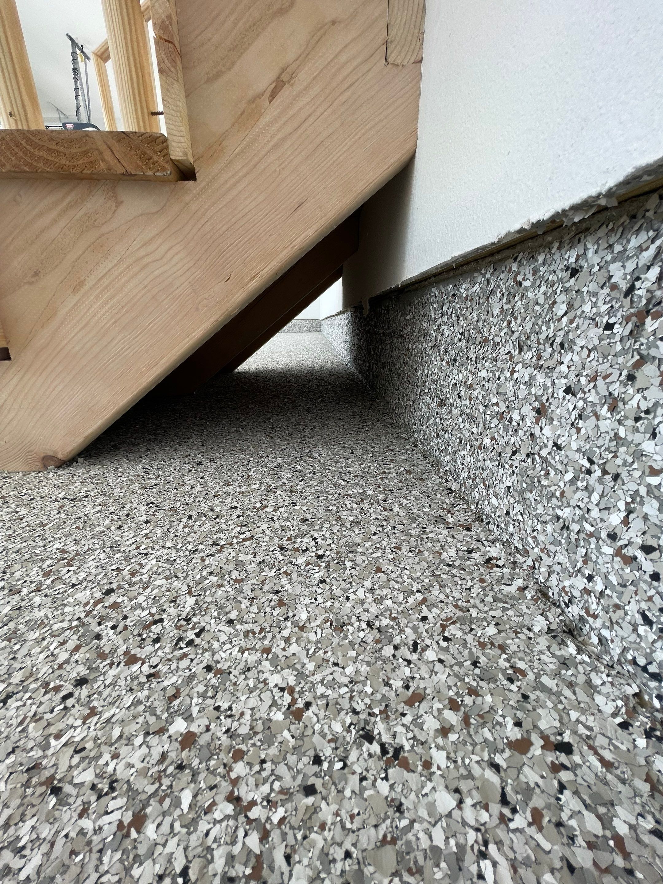 Grey Speckled Garage Floor Coating in Sioux Falls by Select Painting, Coatings & Garage Cabinets