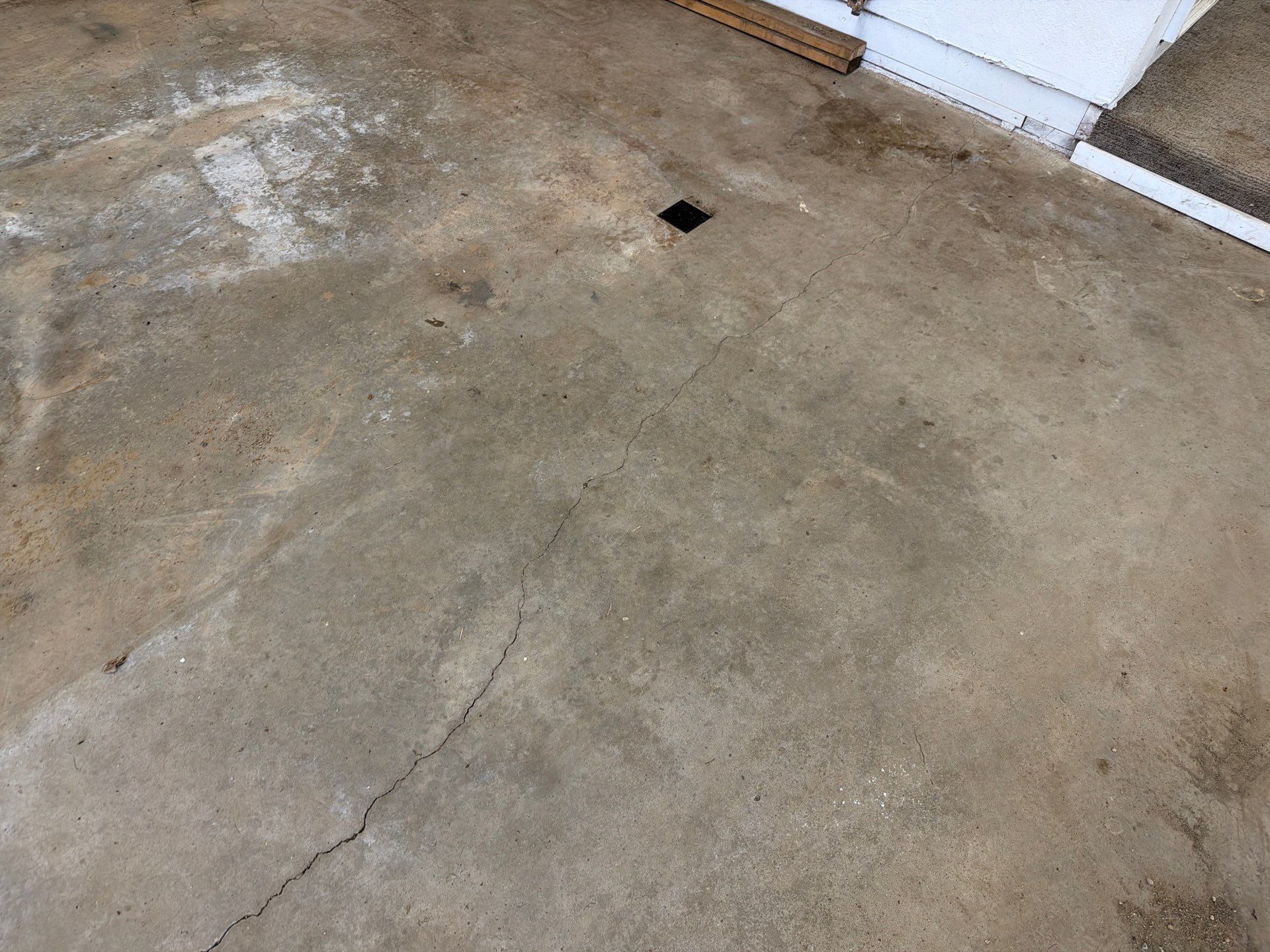 Feather Grey Garage Floor Coating and Crack Repair in Beresford by Select Painting, Coatings & Garage Cabinets