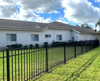 Aluminum Fence Installation using Black 3 Rail Aluminum Fence