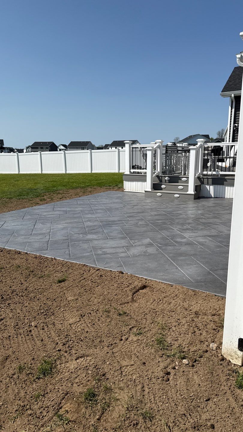 Majestic Ashlar stamped concrete patio  by NG Masonry & Construction LLC