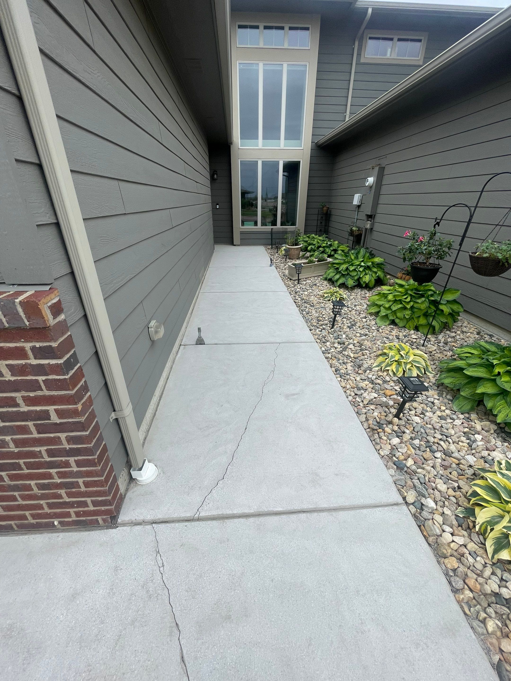 Custom Concrete Coating for Sioux Falls Patio and Front Walkway by Select Painting, Coatings & Garage Cabinets