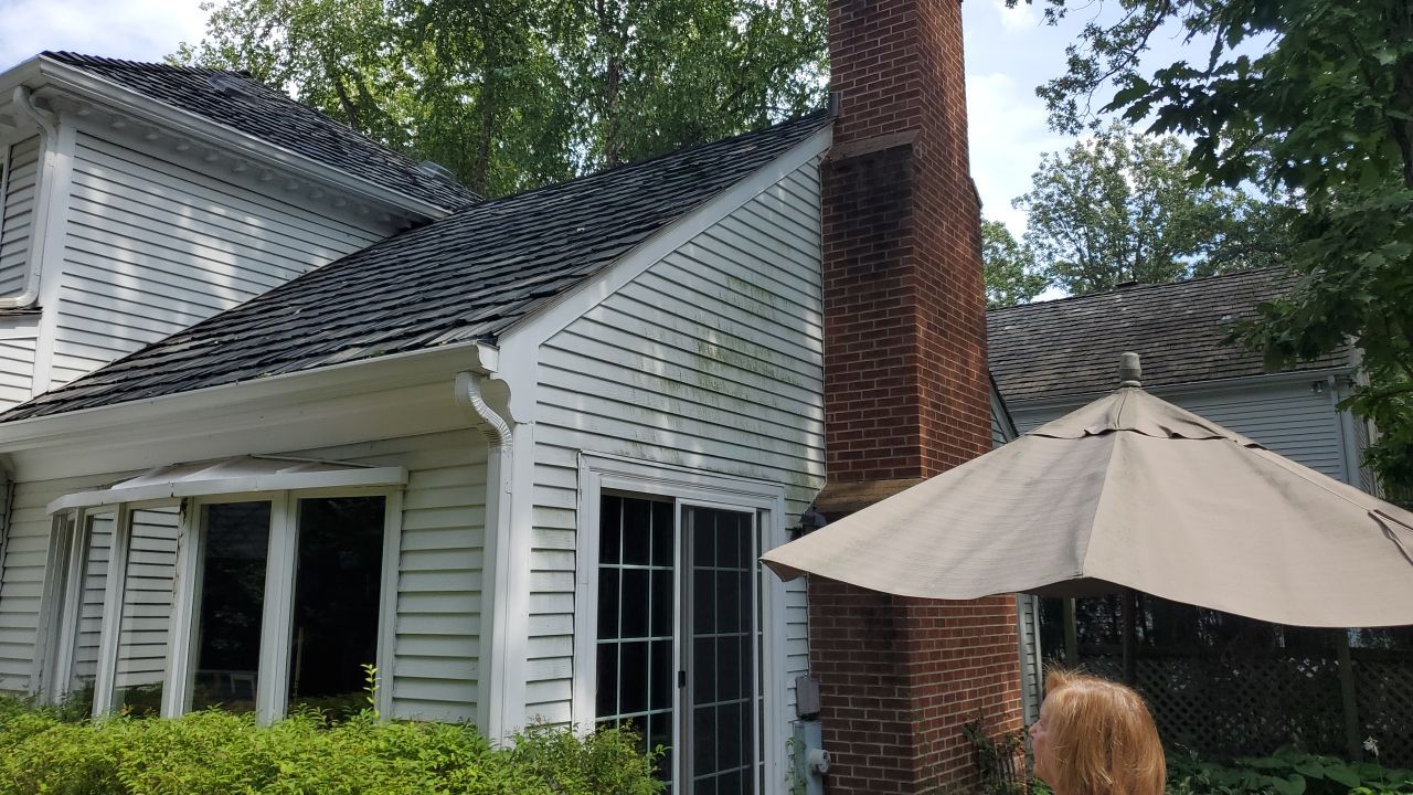 Housewashing  using Algaecide, soft wash soap by Northern Power Washing LLC.