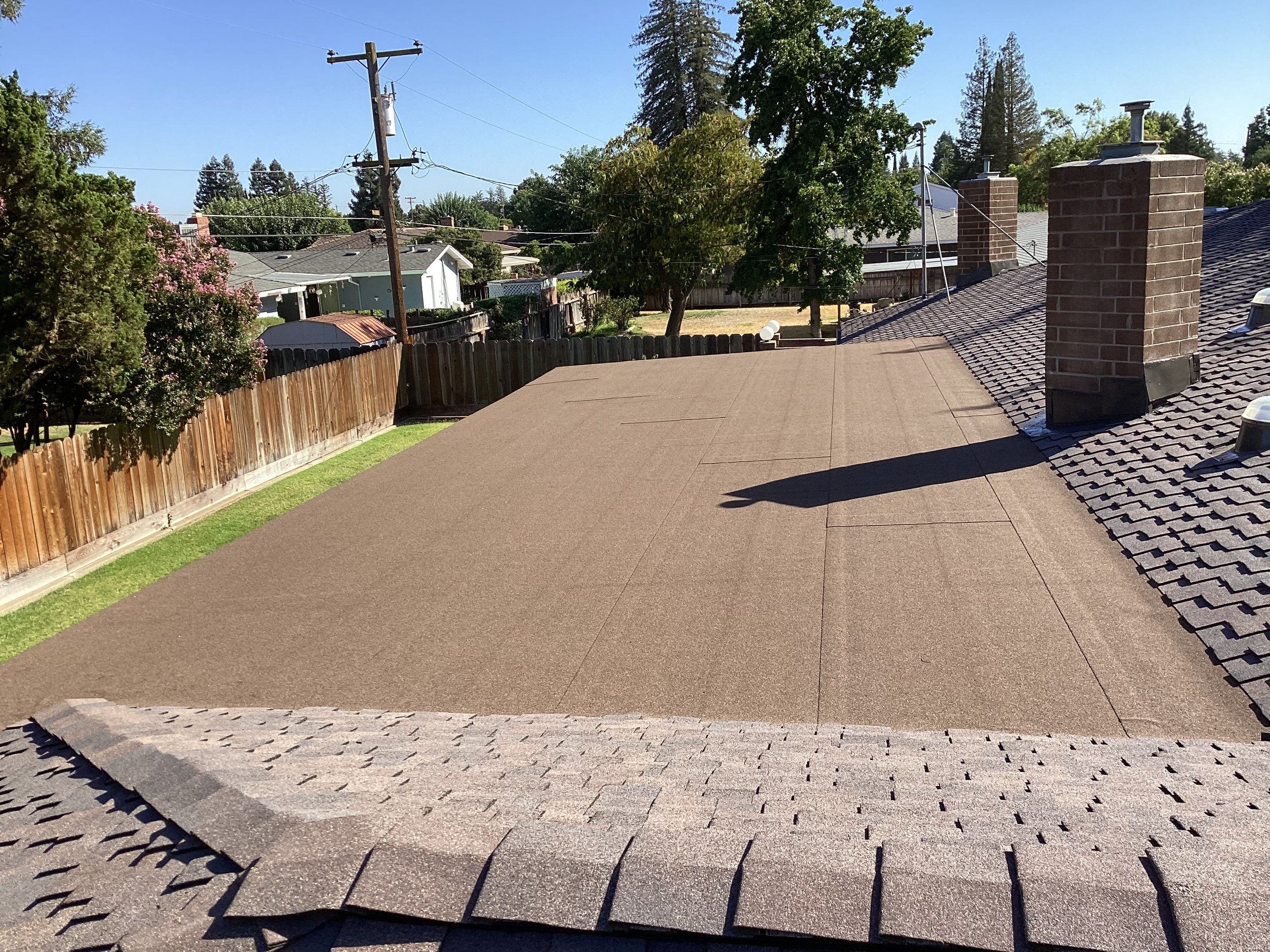 Installation of Certainteed Presidential shingles on residential house by Straight Edge Roofing Inc