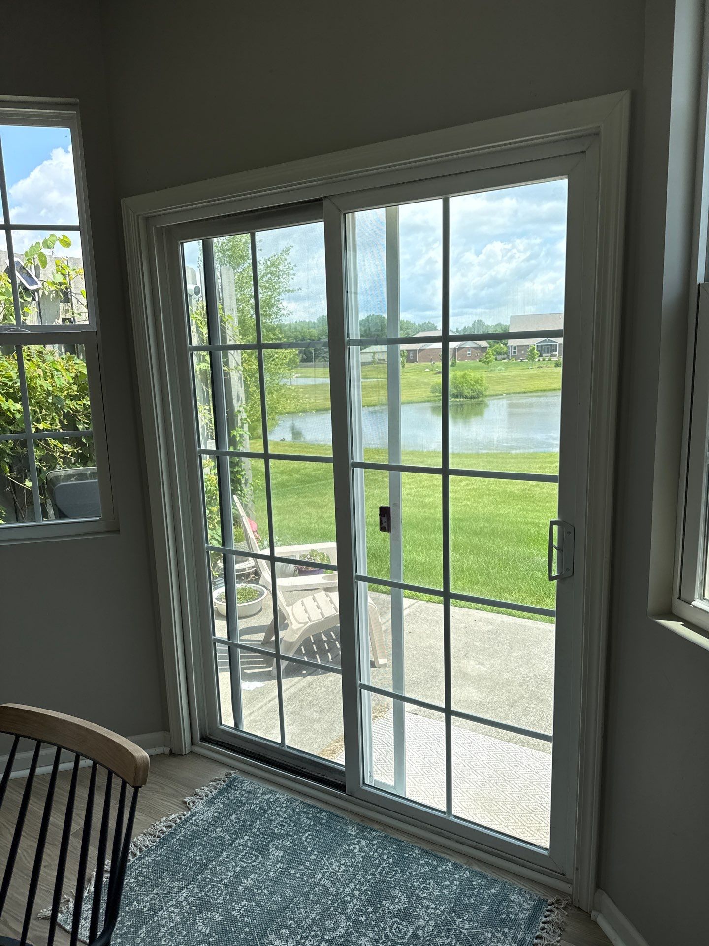 White Vinyl Sliding Patio Door Replacement in McCordsville by Merrifield Exteriors, LLC