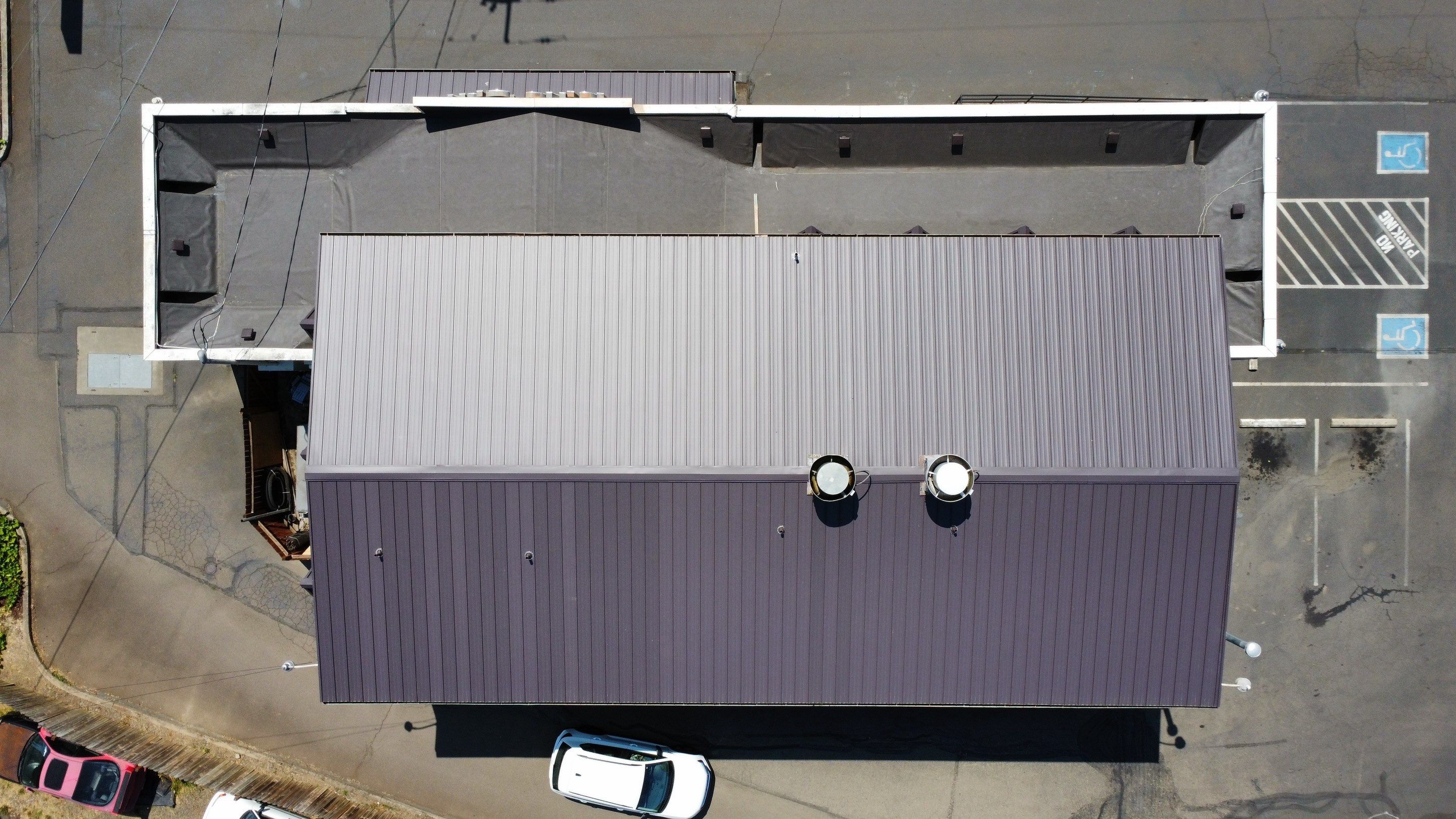 Commercial Flat Roof Installation using Bruce and Dana Snap Lock Metal (Color: Brown) by Orezona Building & Roofing Company, Inc.