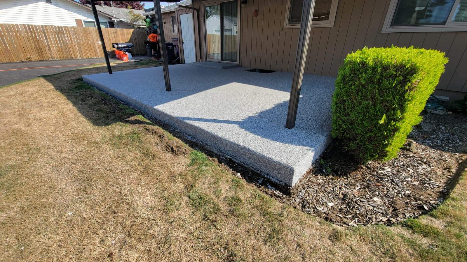 Coastal Elegance Patio in PoseidonVuba Stone by Concrete Coating Experts Inc.