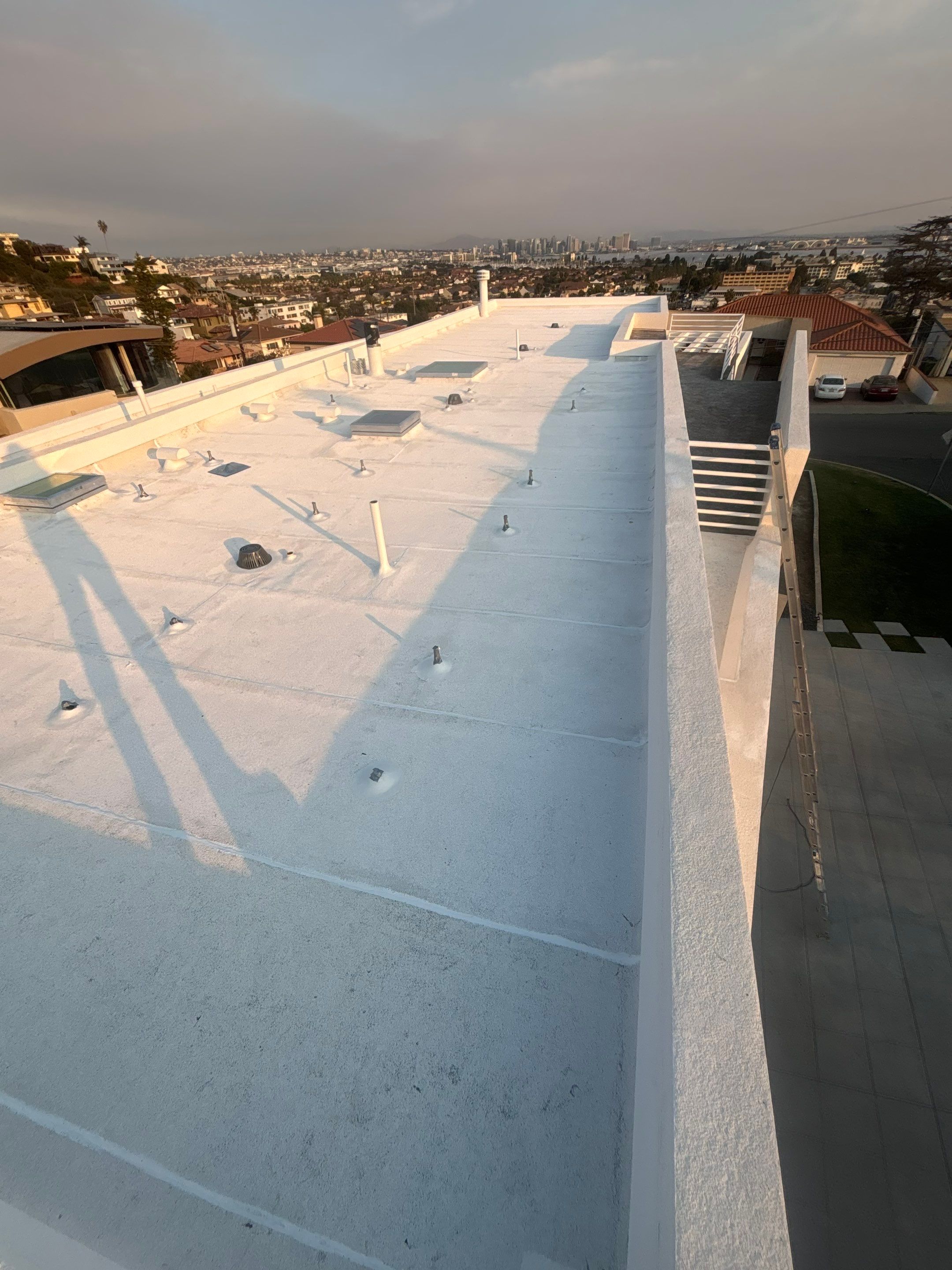 Point Loma Flat Roof Replacement – Johns Manville Bright White Torch-Applied Roofing System by Zenith Roofing Services 