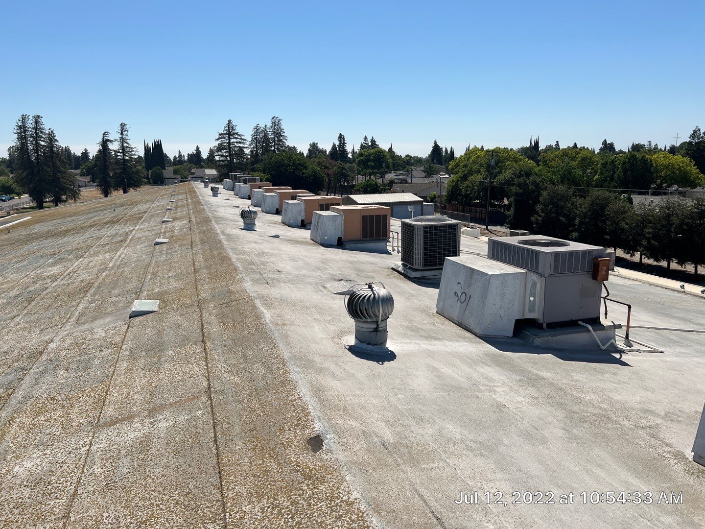 MR Roofing system using Benchmark/PUMA XL coatings over TPO single-ply roofing by Straight Edge Roofing Inc