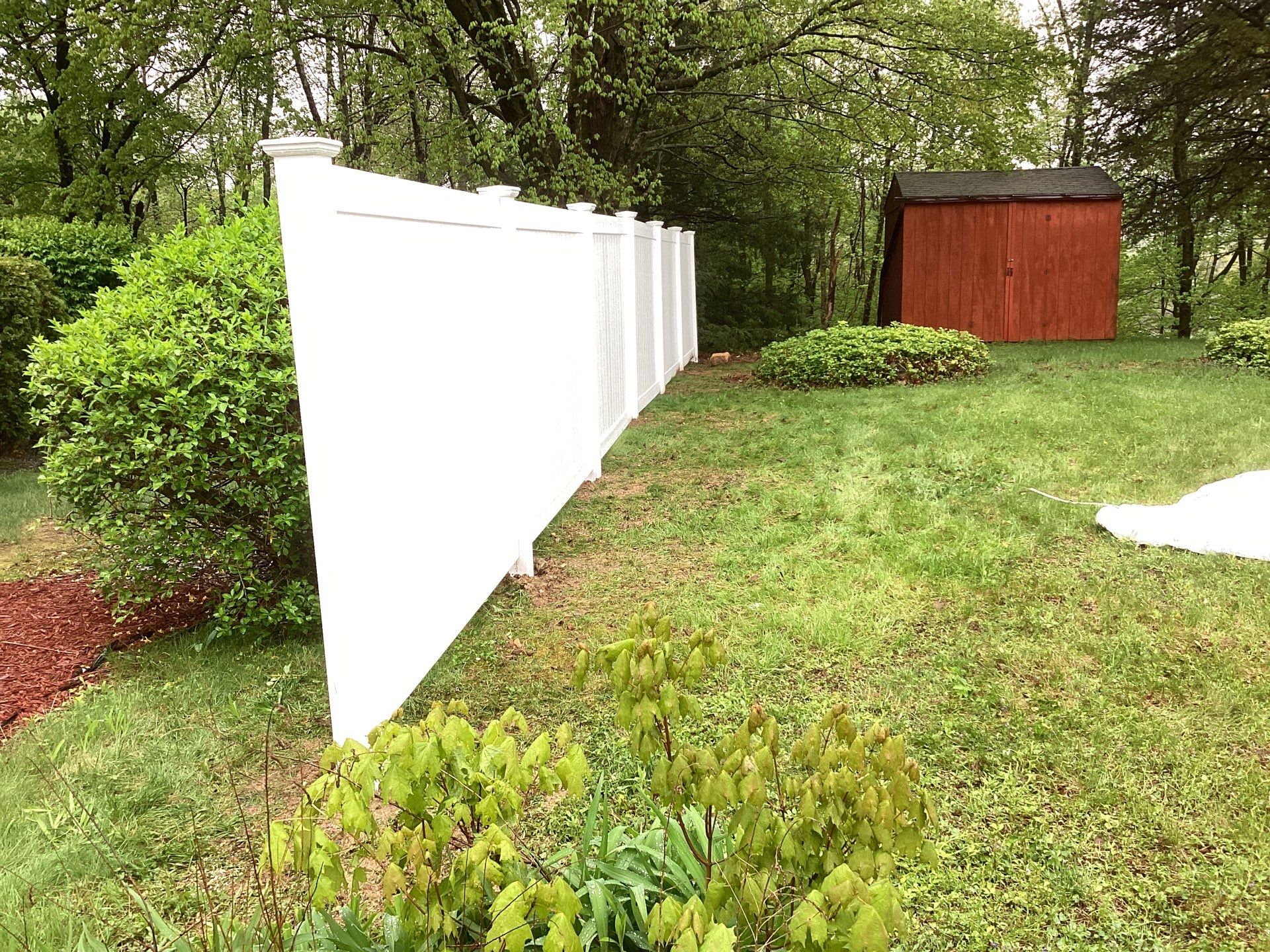 New White Vinyl privacy fence  by DiGiorgi Roofing and Siding Inc