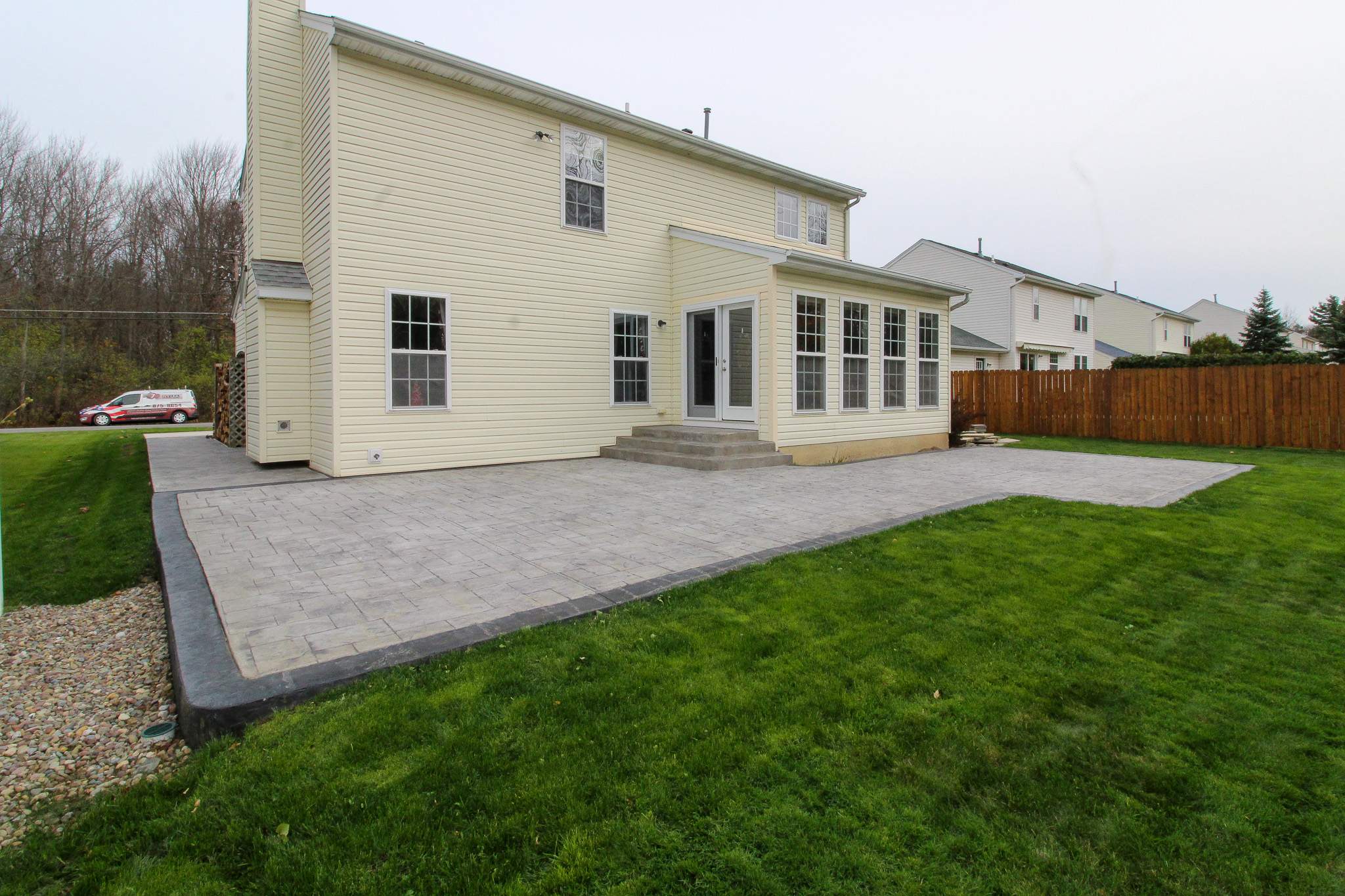 Stamped Concrete, Entry Door, and Concrete  by Ivy Lea Construction