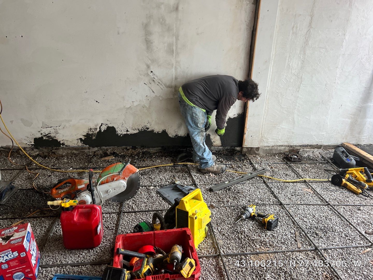 Concrete garage floor replacement with a broom finished apron and wall repair by NG Masonry & Construction LLC